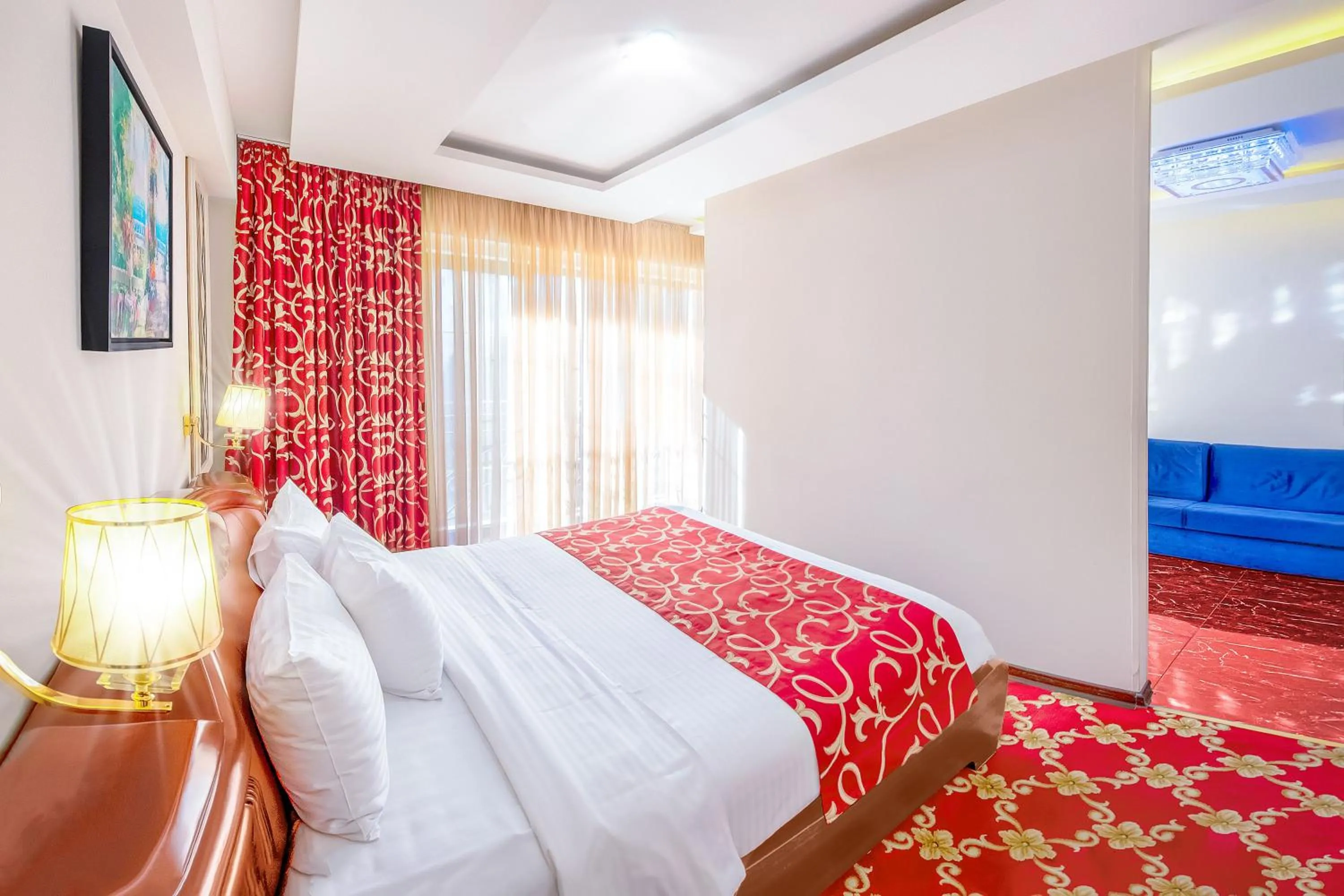 Communal lounge/ TV room, Bed in Cron Palace kosher Tbilisi Hotel