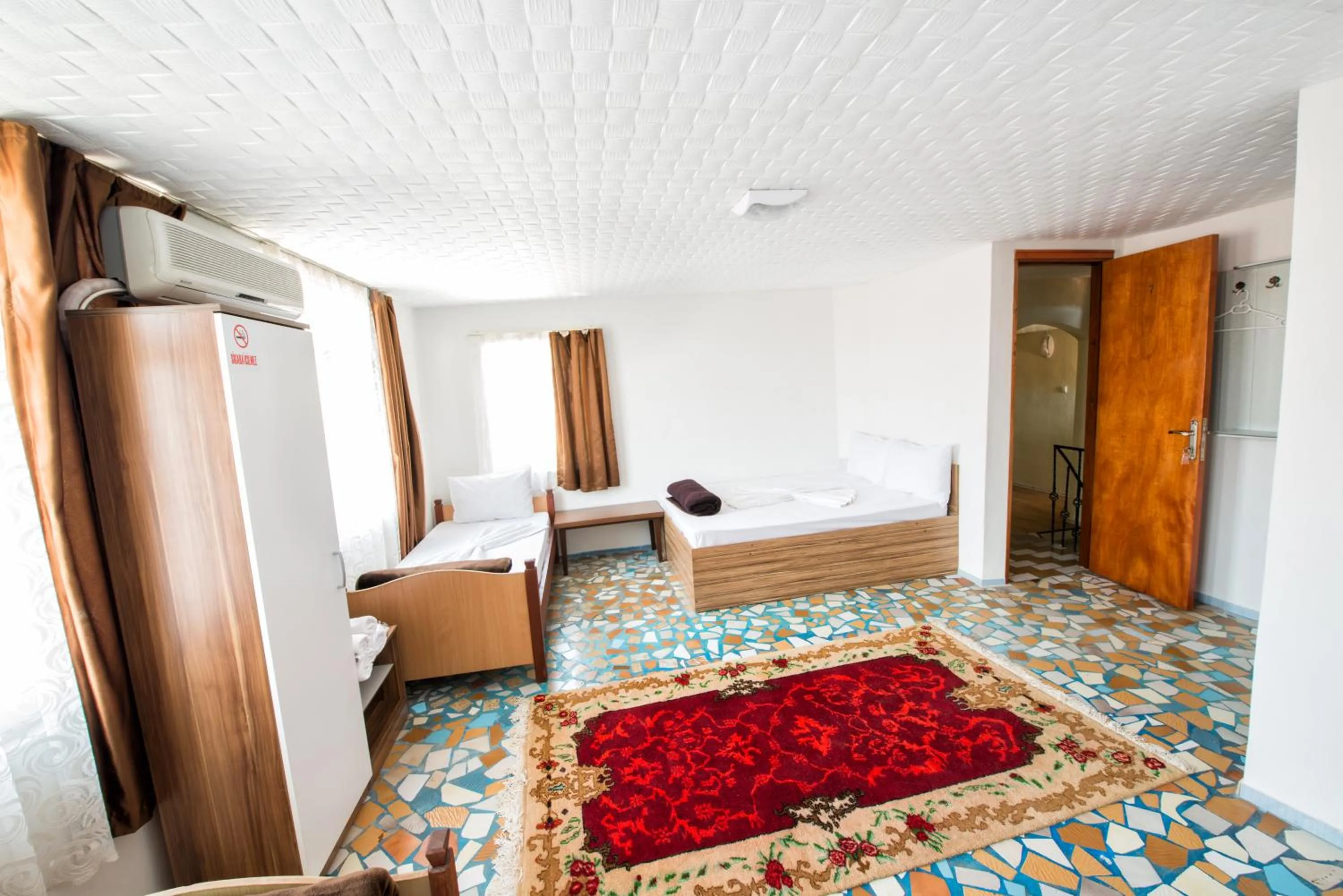 Bed in Yellow Rose Pansiyon