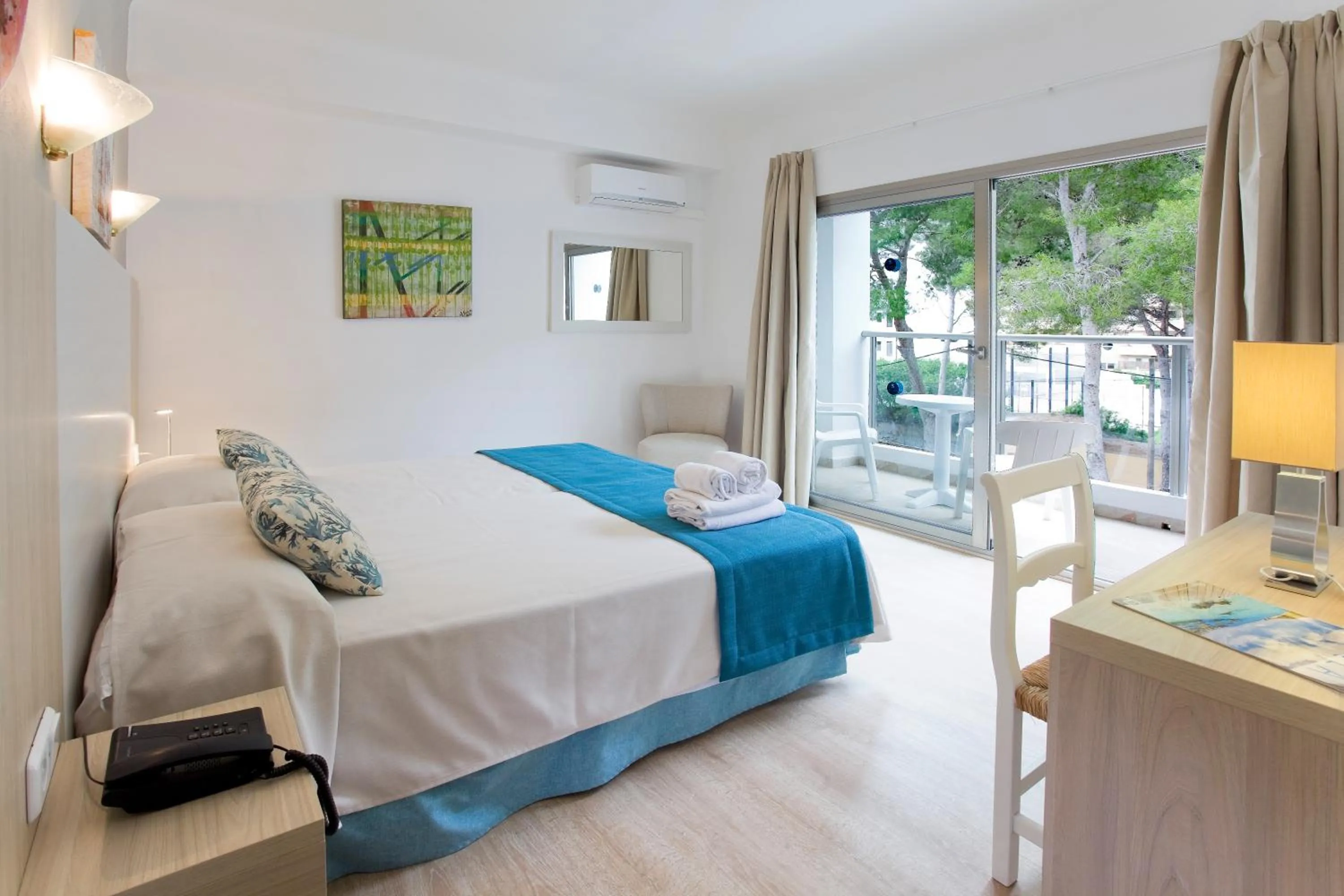 Photo of the whole room, Bed in Petit Garden Hotel by Flacalco