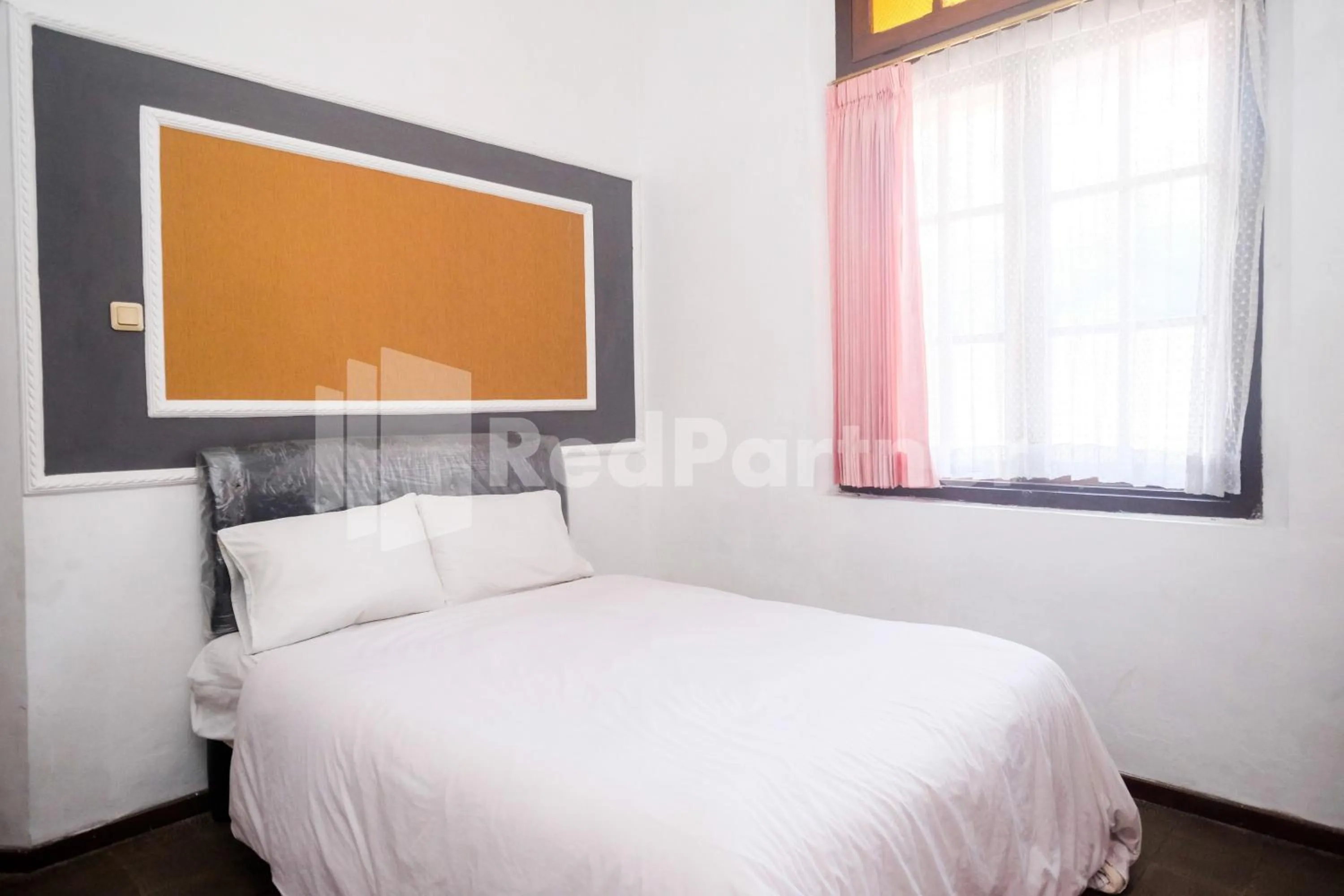 Bed in Hotel Limaran 1 Syariah Malioboro Mitra RedDoorz