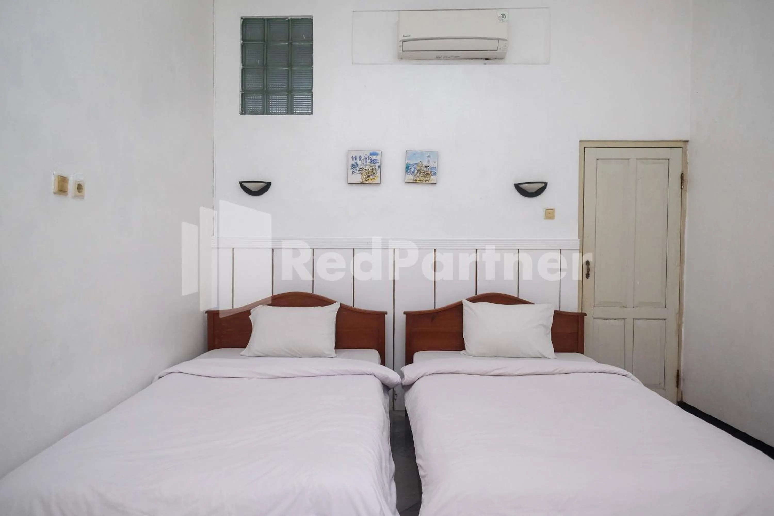 Bed in Hotel Limaran 1 Syariah Malioboro Mitra RedDoorz