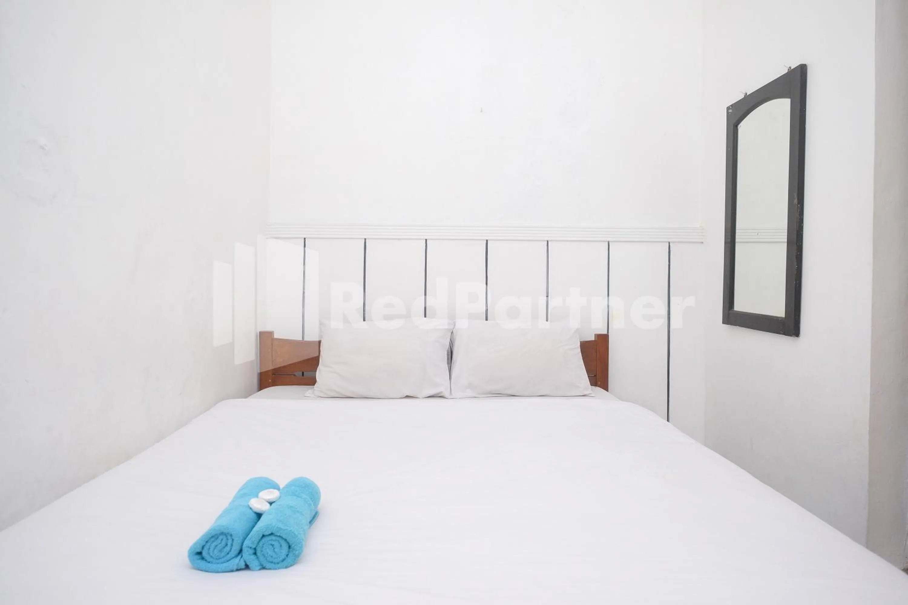 Bed in Hotel Limaran 1 Syariah Malioboro Mitra RedDoorz