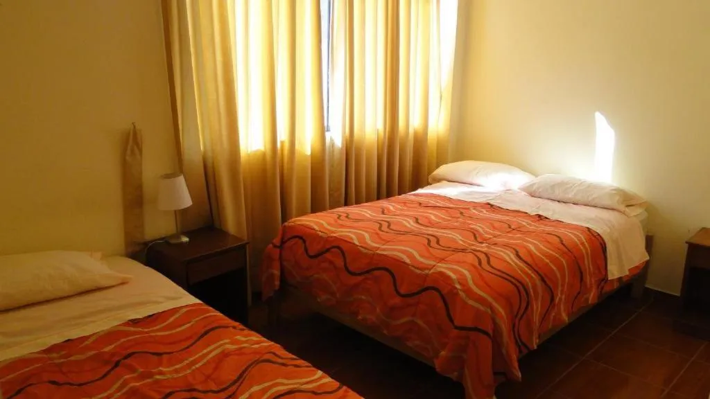 Photo of the whole room, Bed in Hostal Huacachina Sunset