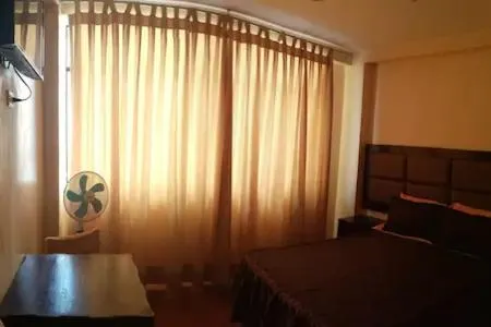 Photo of the whole room, Bed in Hostal Huacachina Sunset