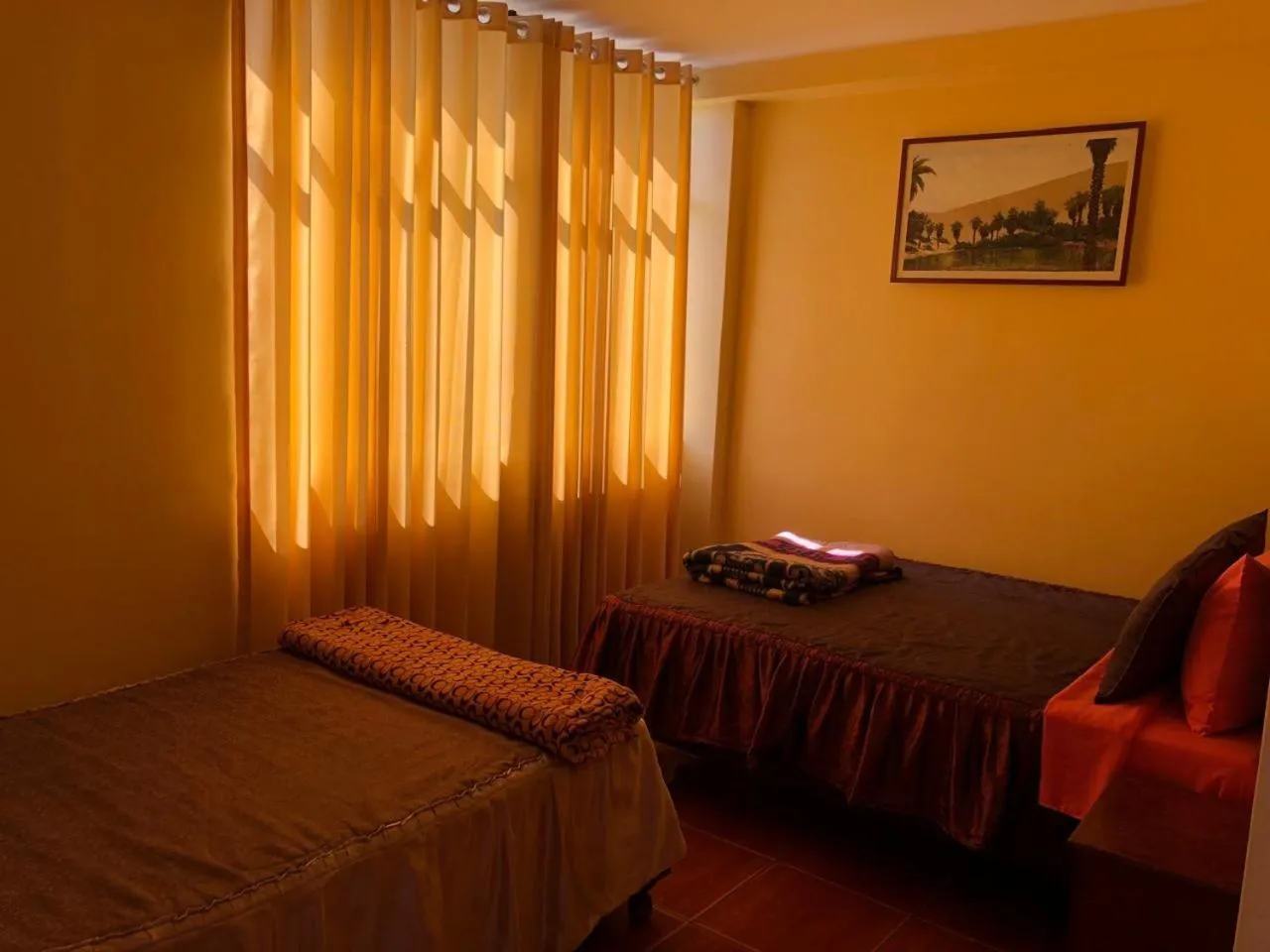 Bed in Hostal Huacachina Sunset