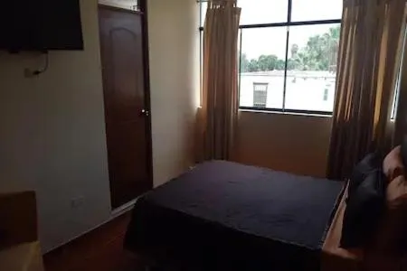 Bed in Hostal Huacachina Sunset