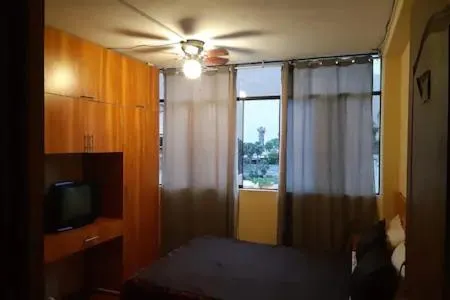 Bed in Hostal Huacachina Sunset