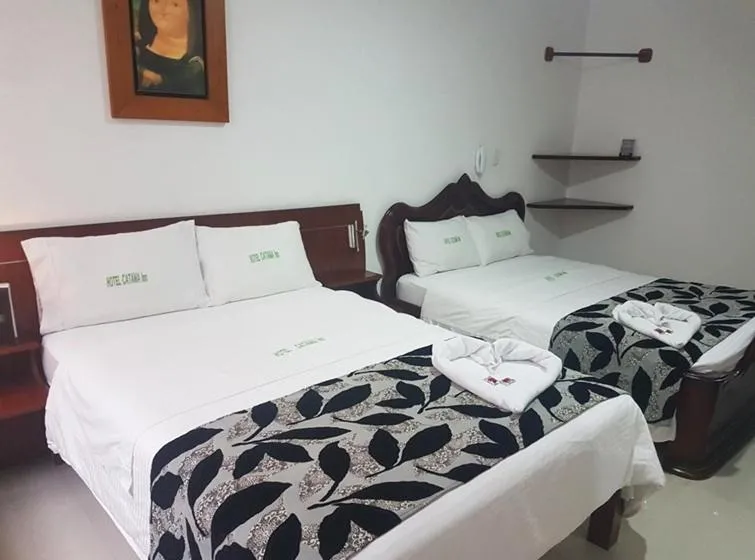 Bed in Hotel Catama Inn