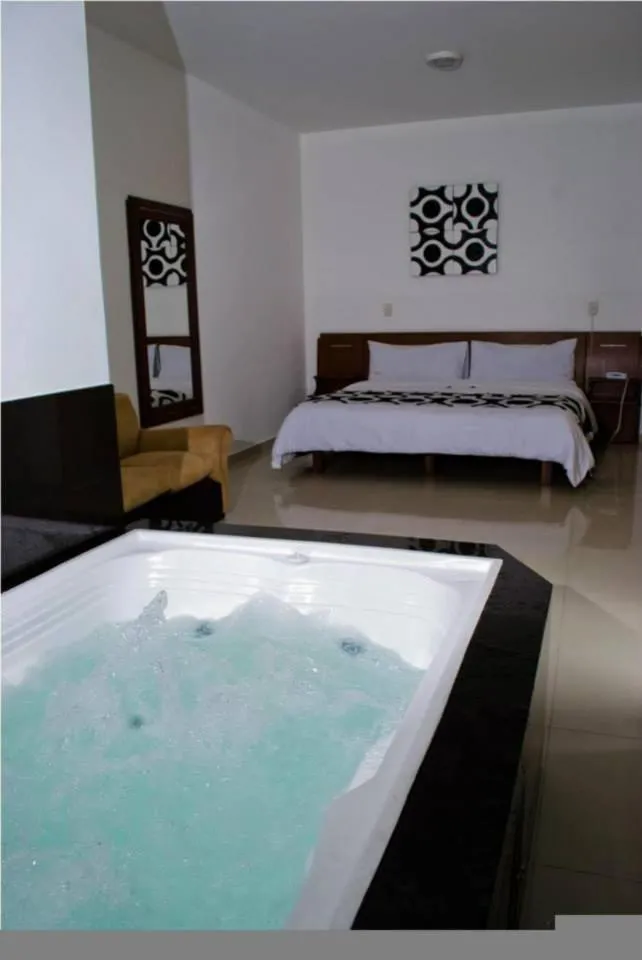 Bed in Hotel Catama Inn
