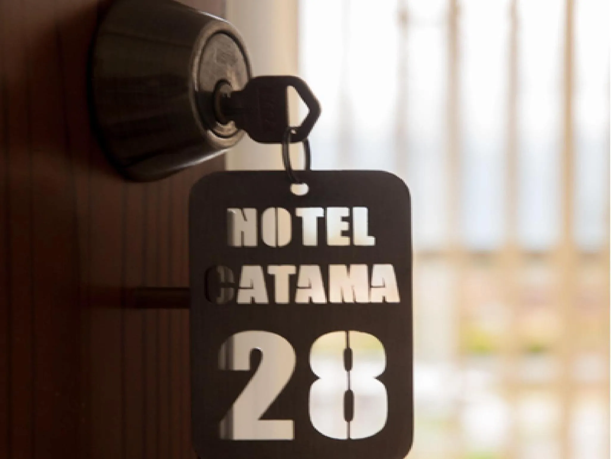 Property logo or sign in Hotel Catama Inn