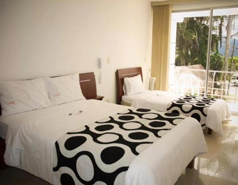 Bed in Hotel Catama Inn