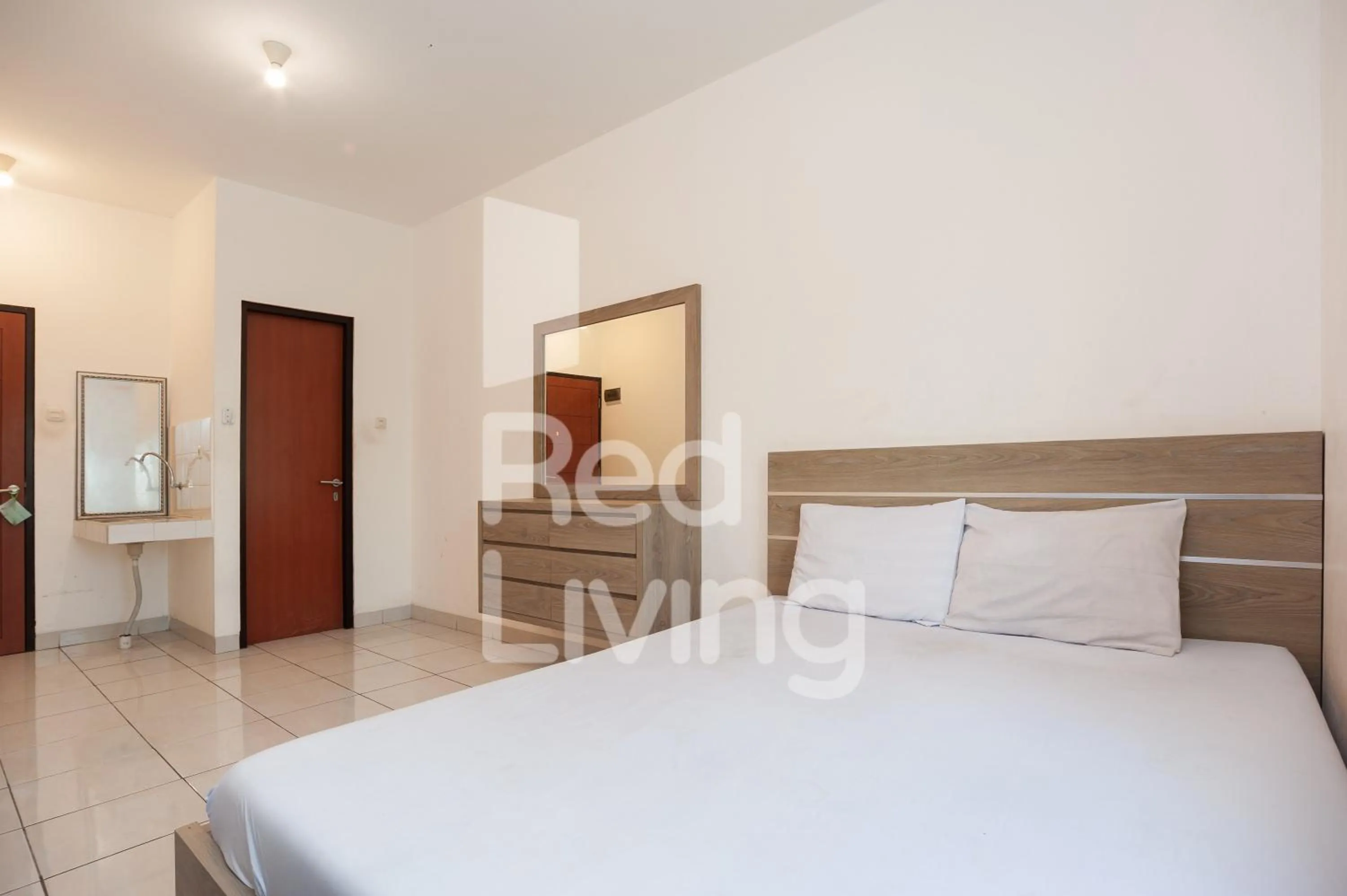 Bed in RedLiving Apartemen RQ at Ecohome Citra Raya