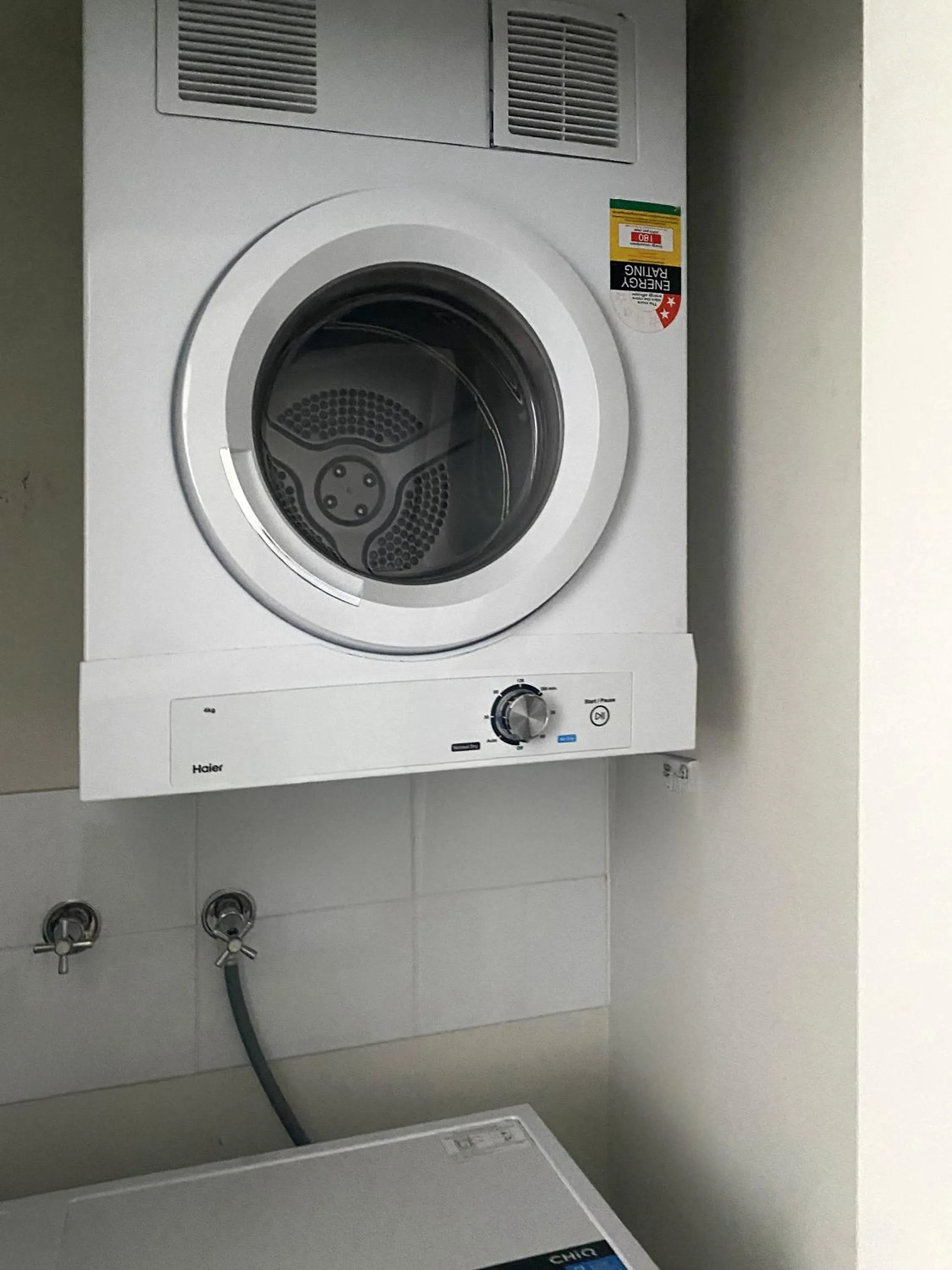 washing machine in Curtis Central Apartments Official