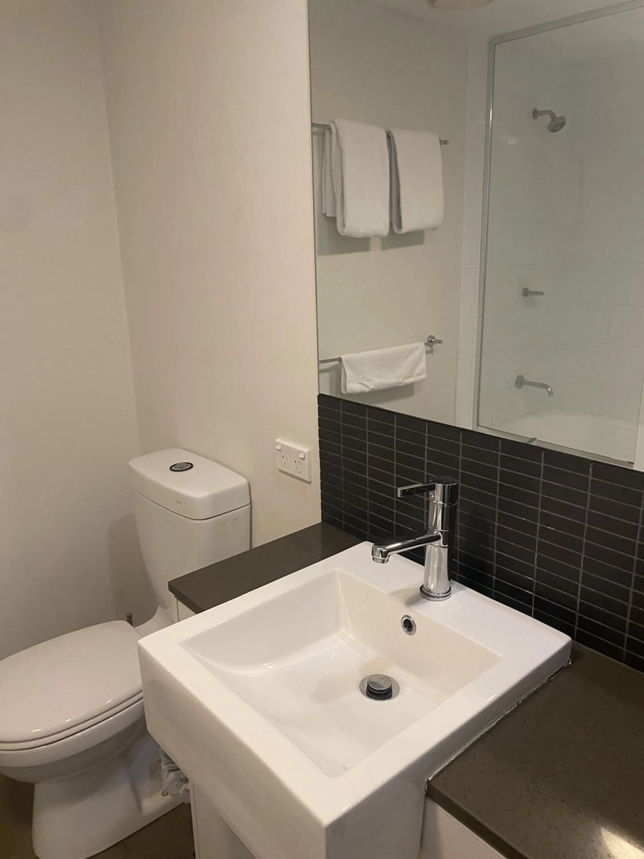 Toilet in Curtis Central Apartments Official