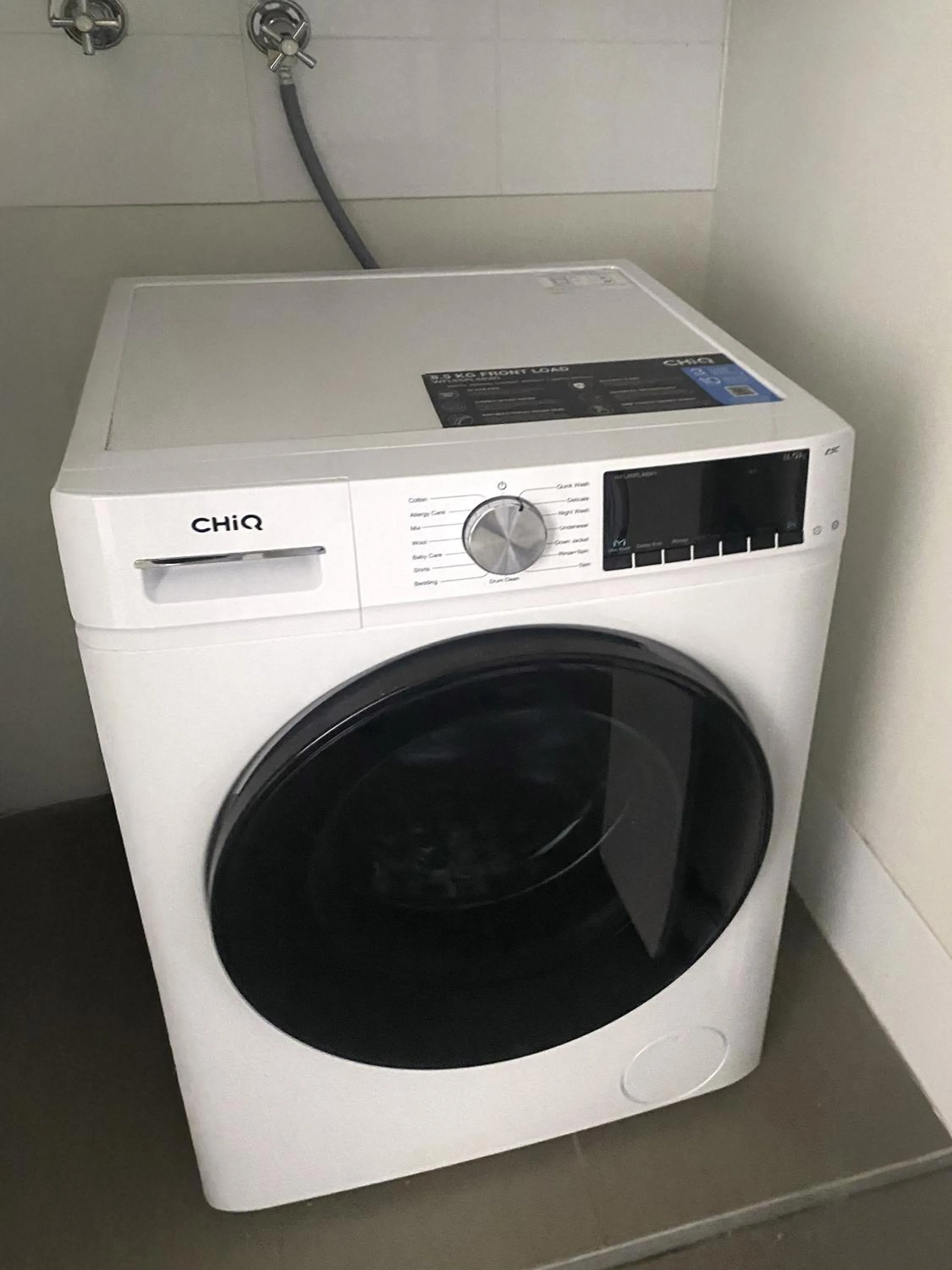 washing machine in Curtis Central Apartments Official