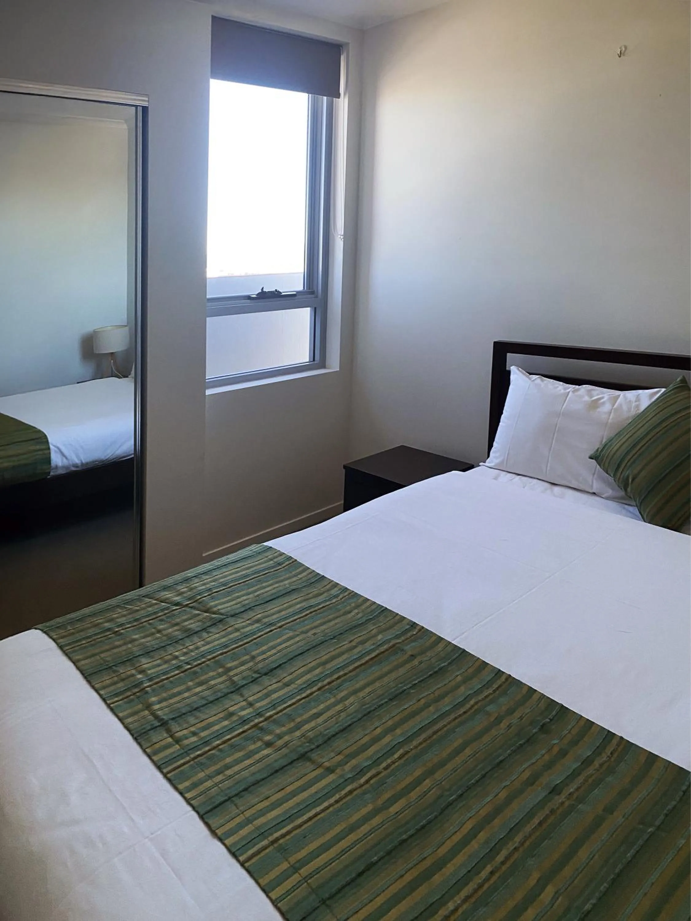 Bedroom, Bed in Curtis Central Apartments Official