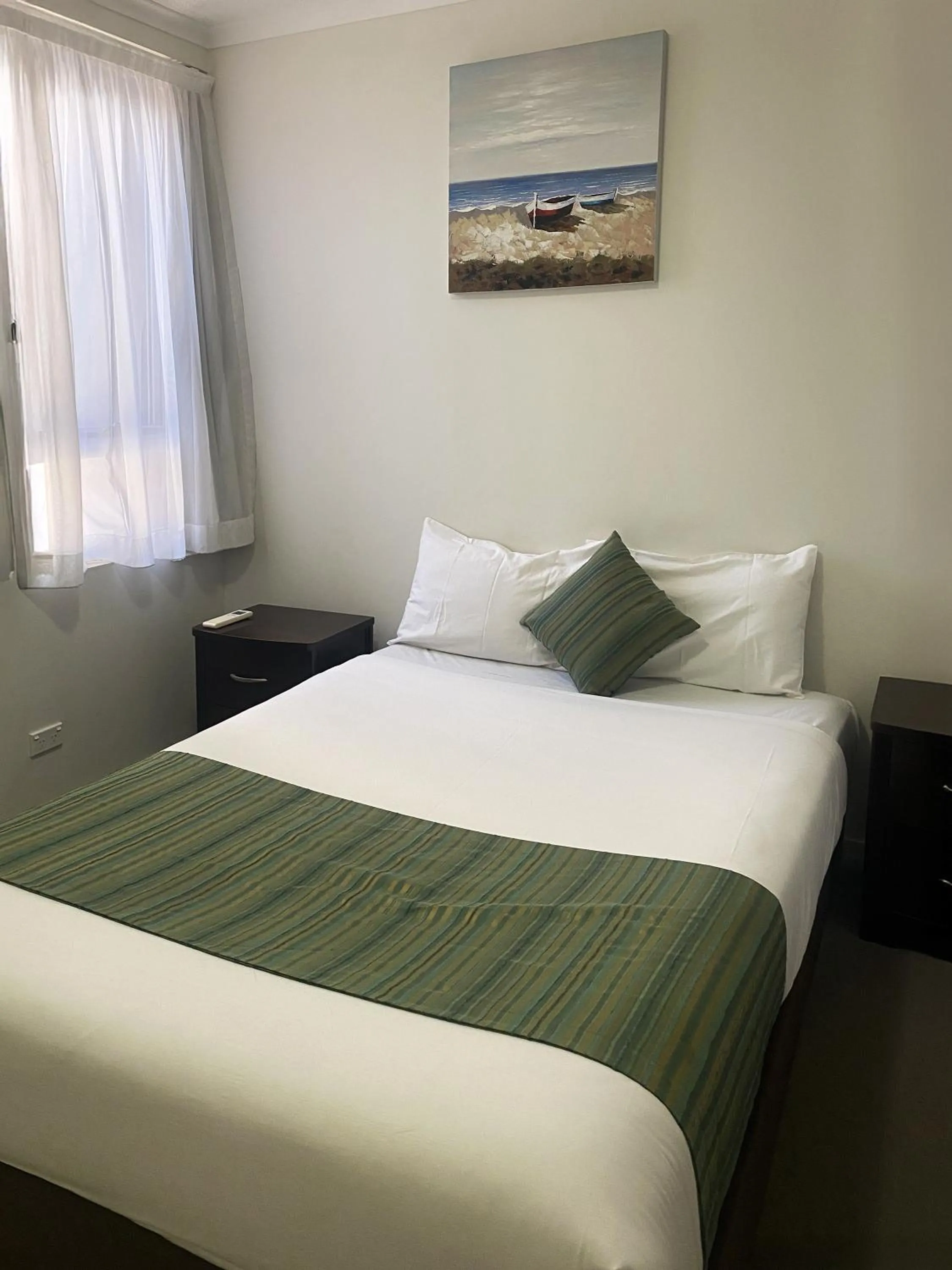 Bedroom, Bed in Curtis Central Apartments Official