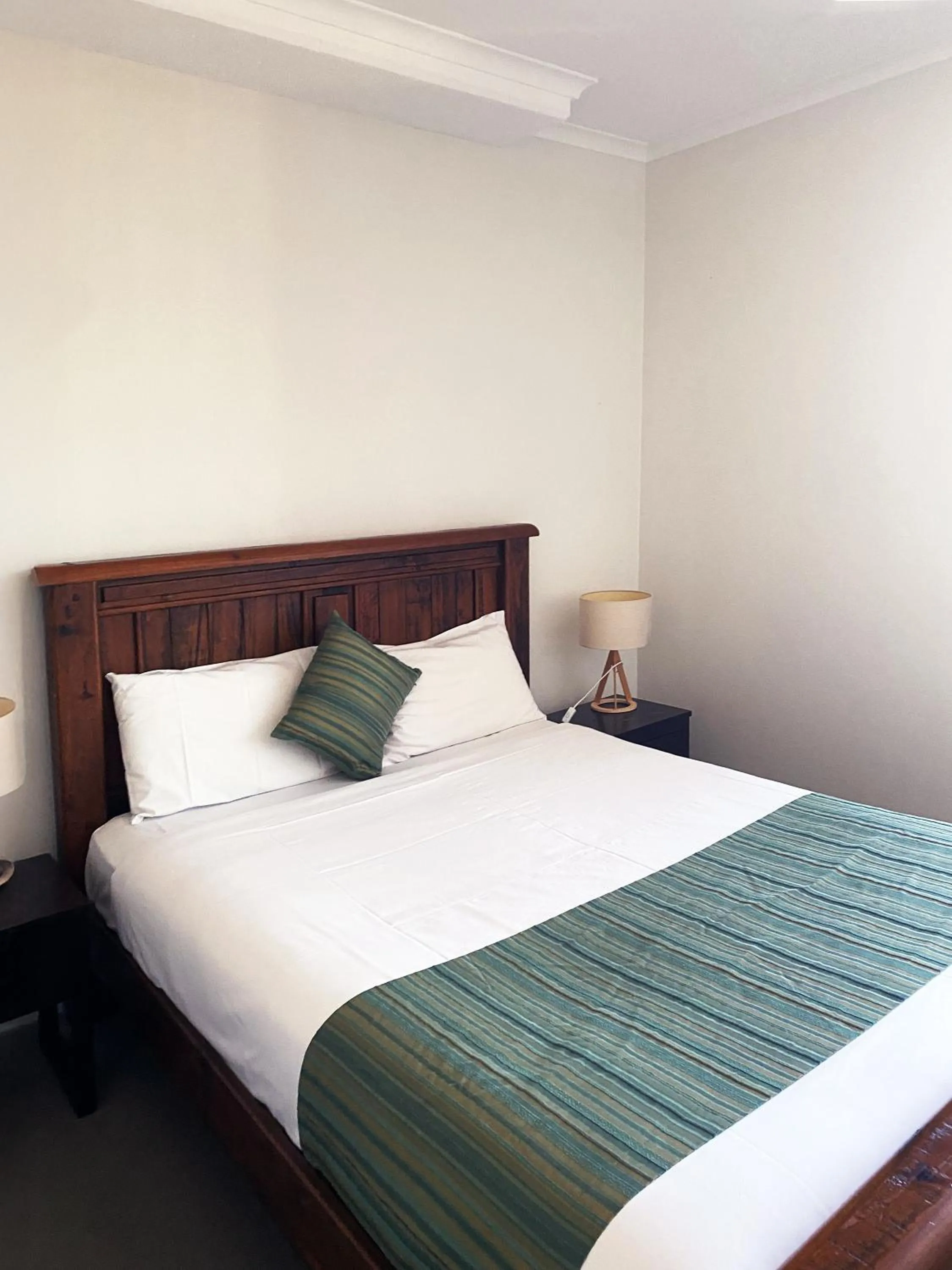 Bed in Curtis Central Apartments Official