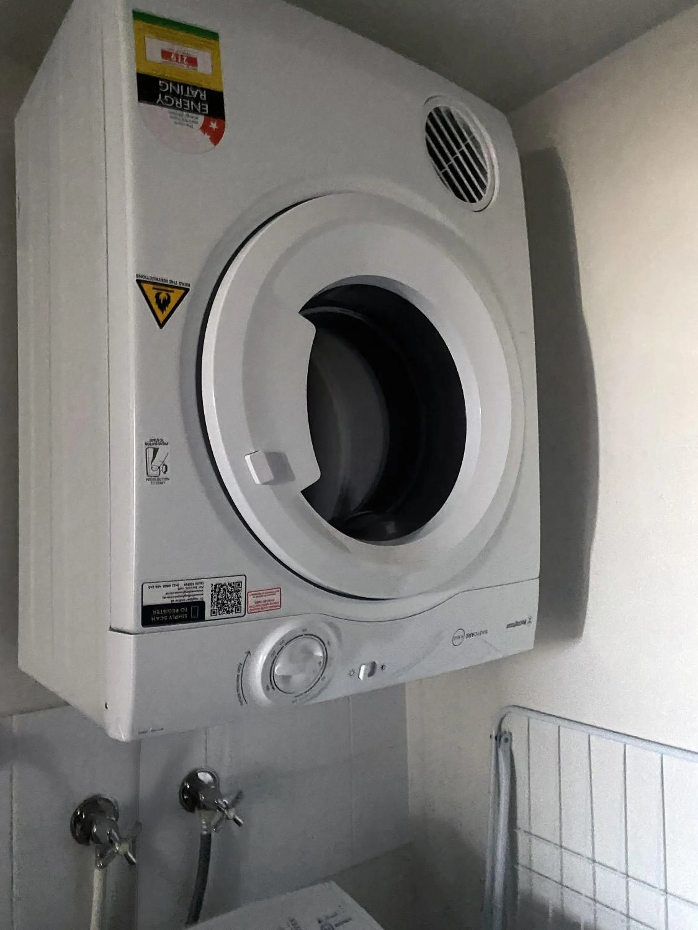 washing machine in Curtis Central Apartments Official