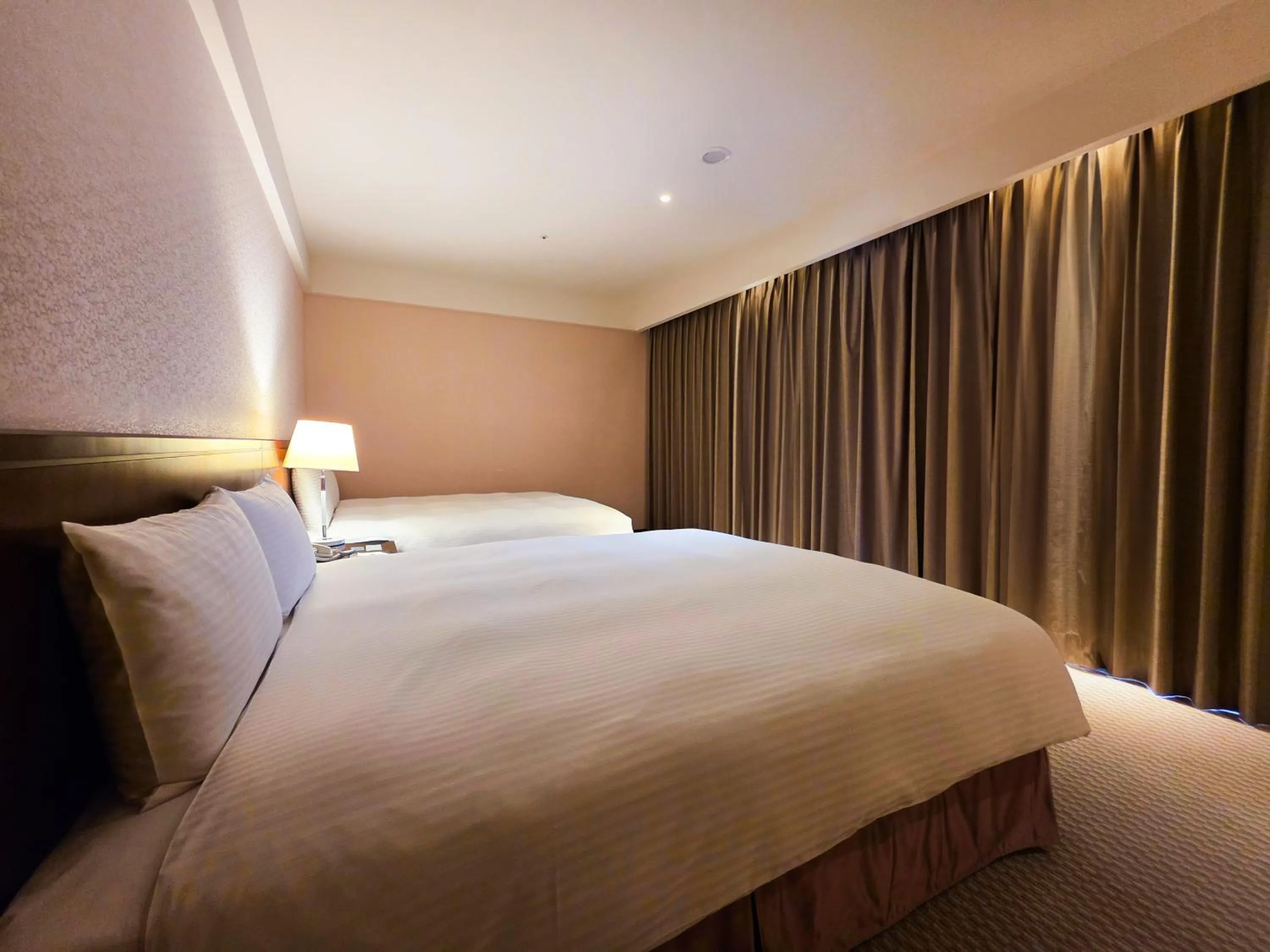 Bed in 雀客旅館台中來來