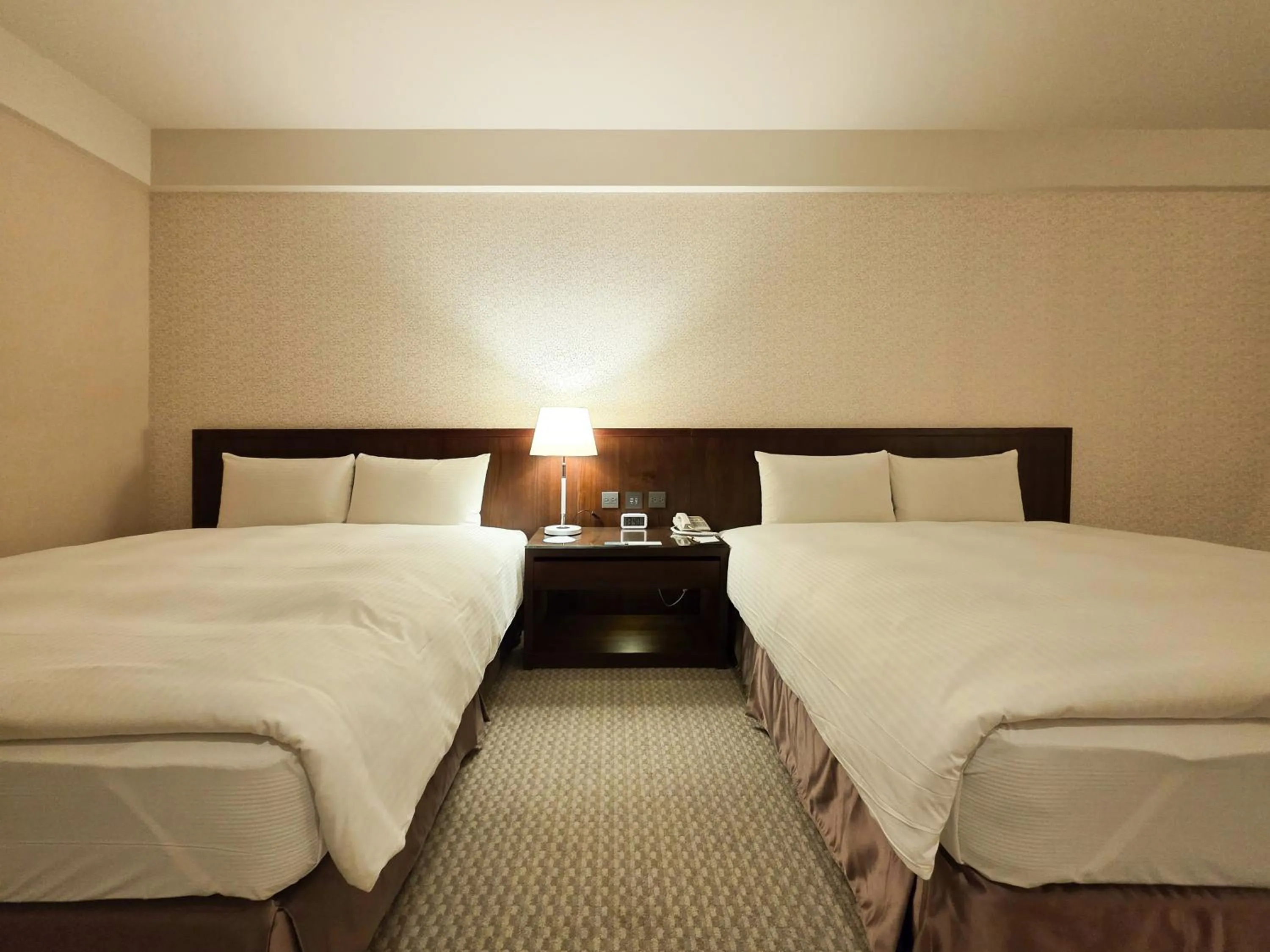 Bed in 雀客旅館台中來來