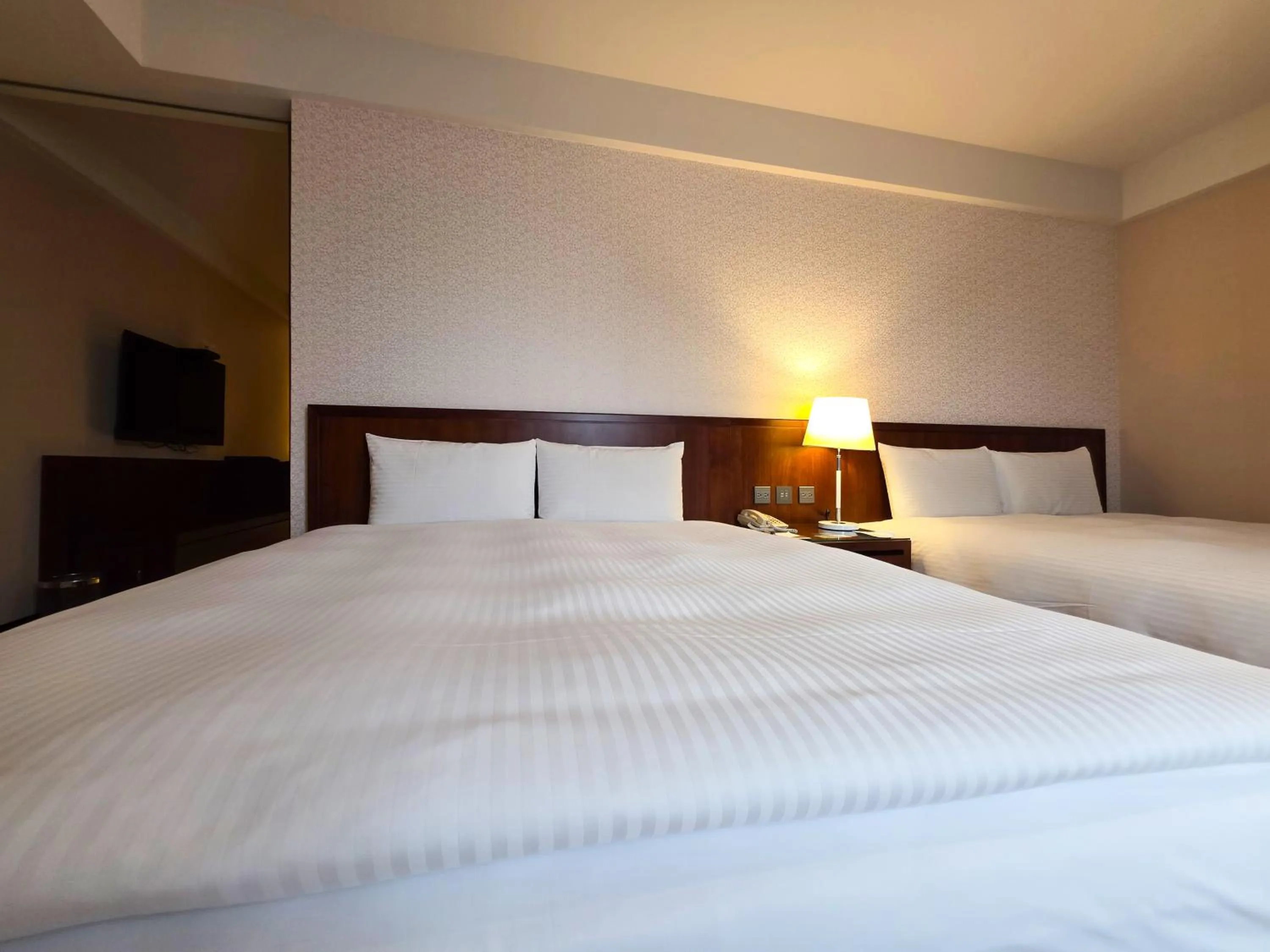 Bed in 雀客旅館台中來來