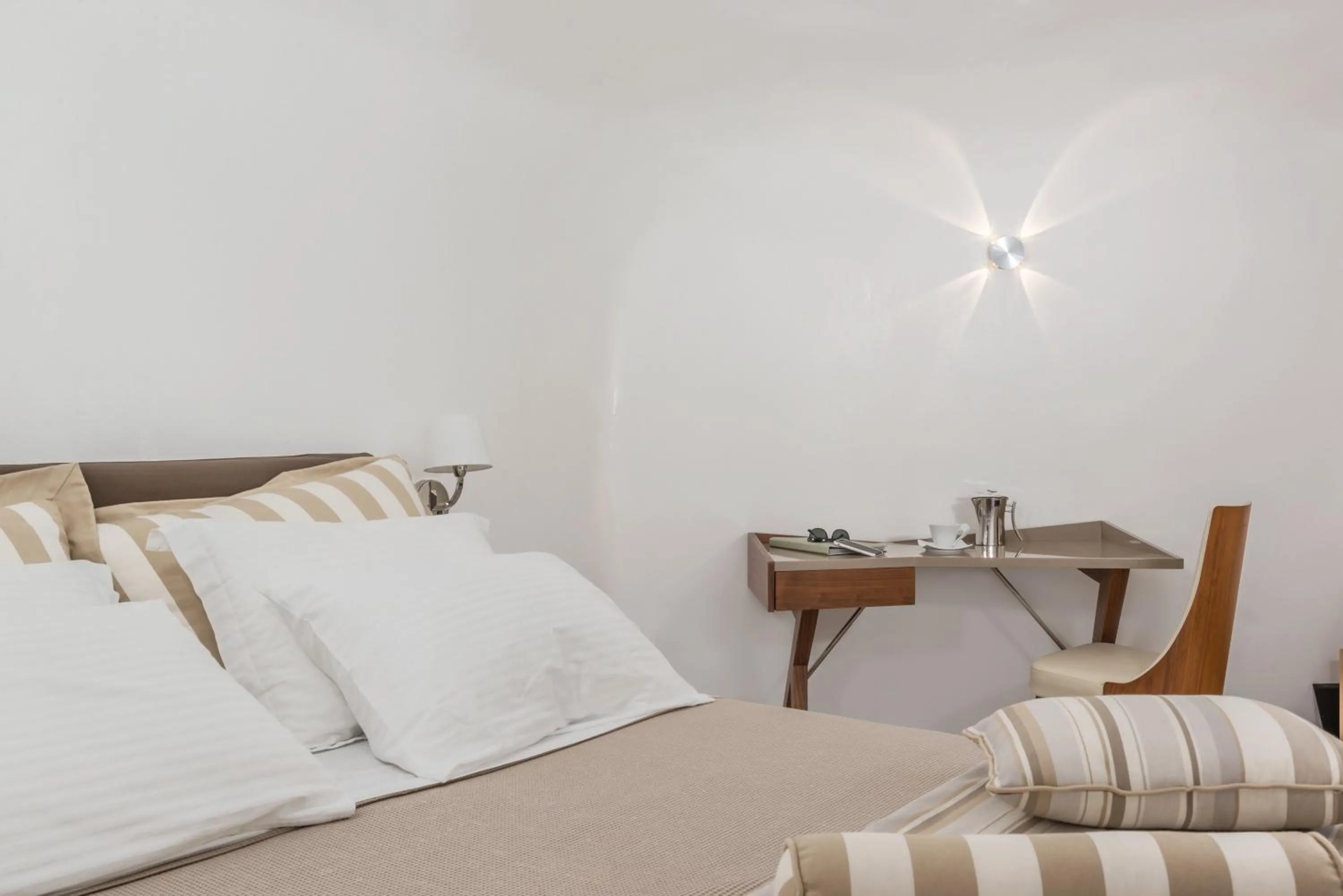 Bed in Elite Luxury Suites