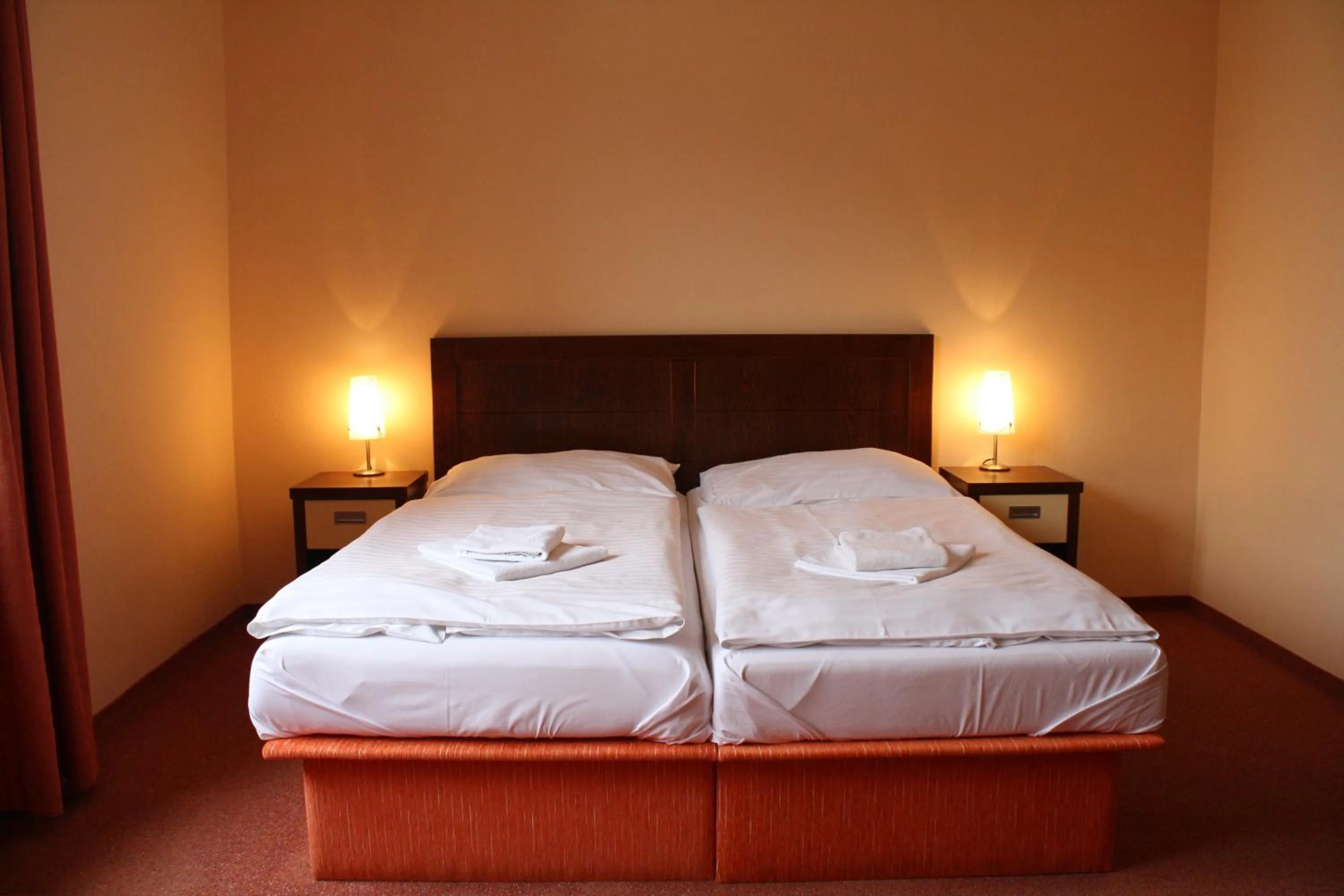 Bed in Garni Hotel Cosmopolitan