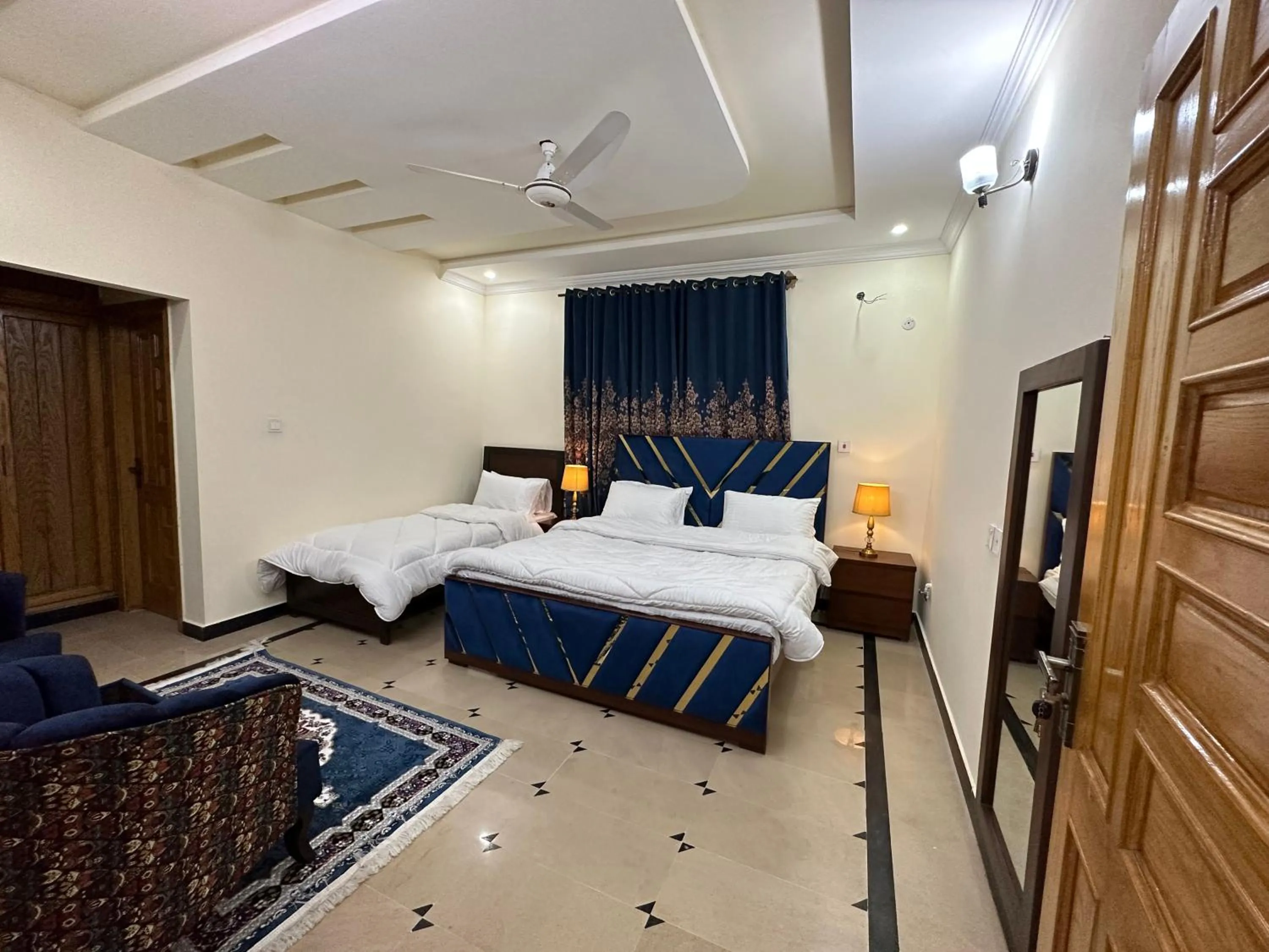 Bed in Roomi Guest House