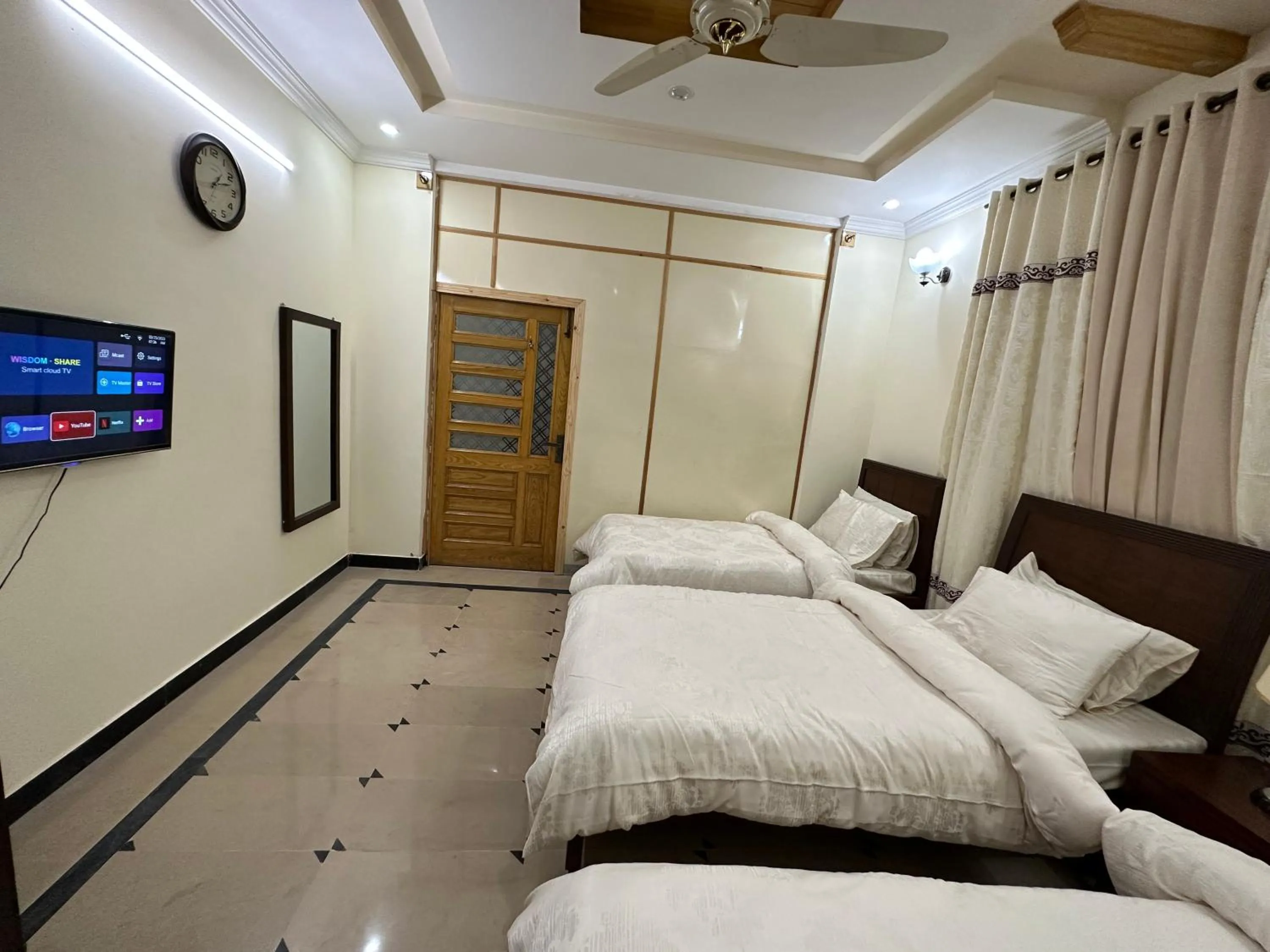 Bed in Roomi Guest House