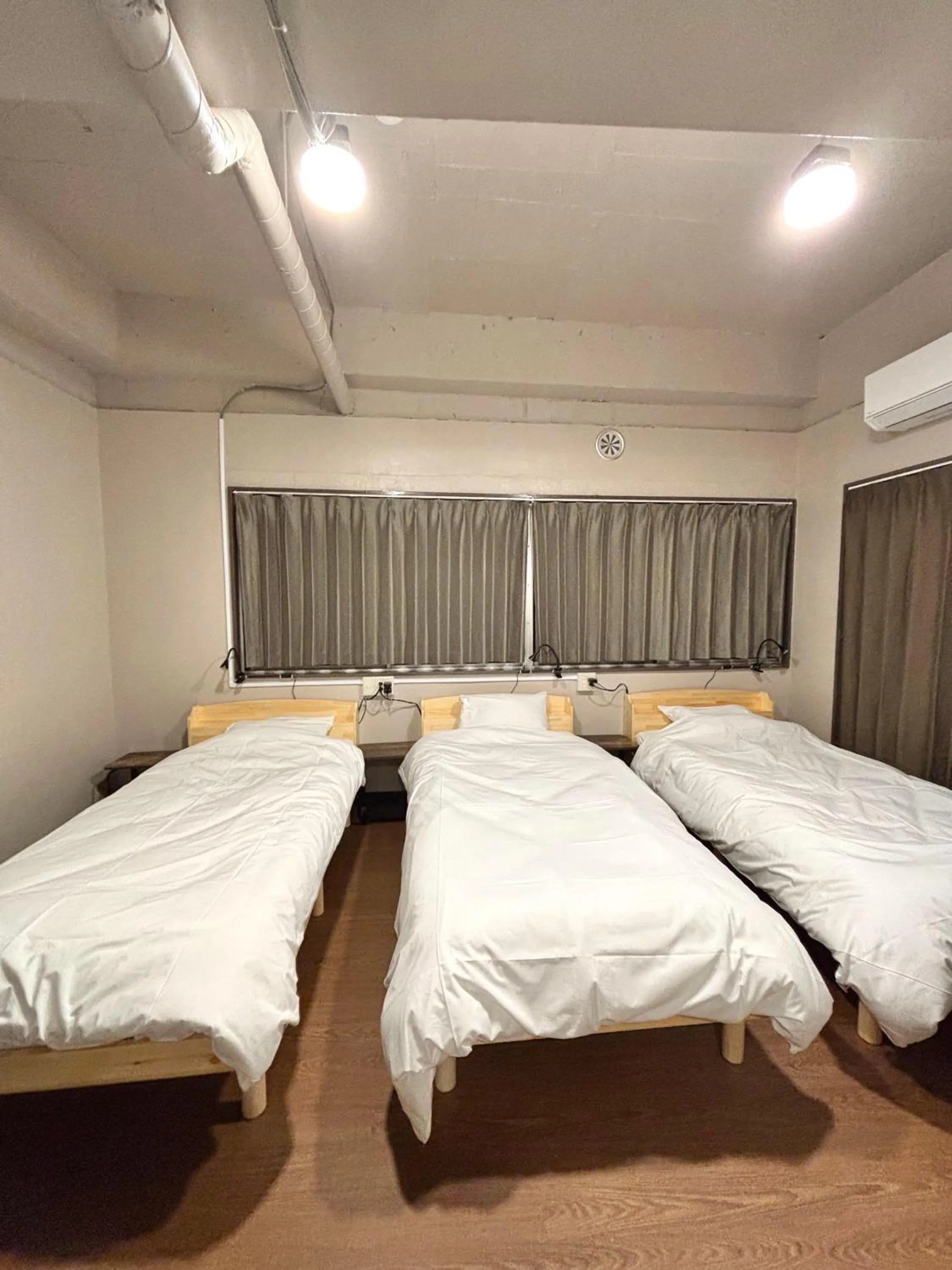 Bed in Wasabi Mita Hotel