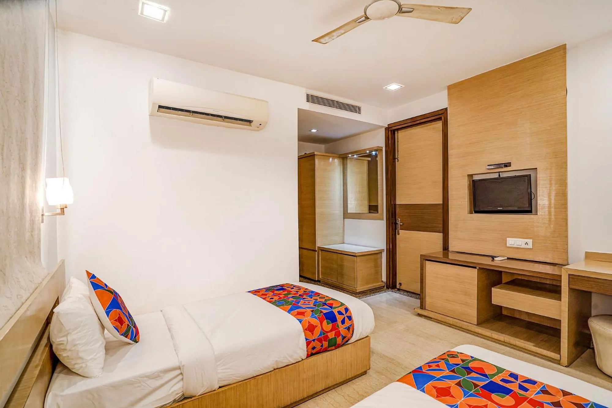Communal lounge/ TV room, Bed in FabExpress Vasundhara Suits