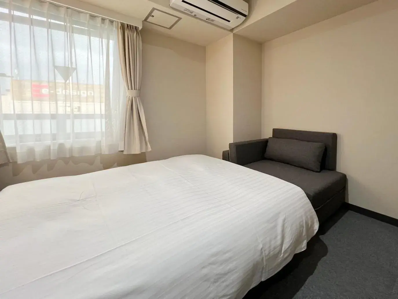 Bed in CHECKinn Osaka Shinimamiya Bed in CHECKinn Osaka Shinimamiya