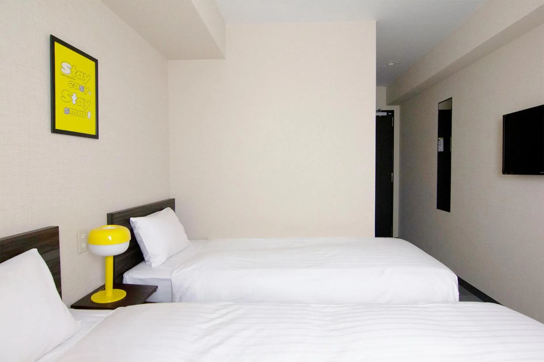 Bed in CHECKinn Osaka Shinimamiya