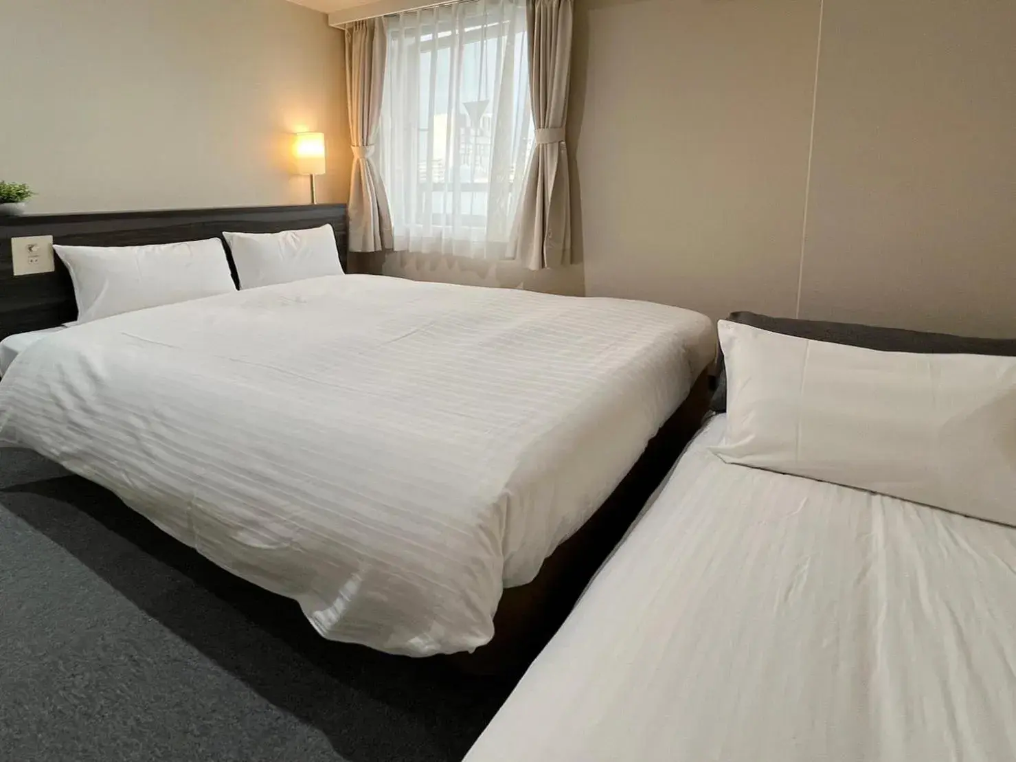 Bed in CHECKinn Osaka Shinimamiya Bed in CHECKinn Osaka Shinimamiya