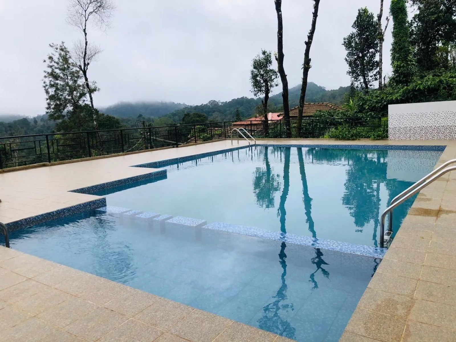 Swimming pool in Mothers Bounty by Lazo , Coorg
