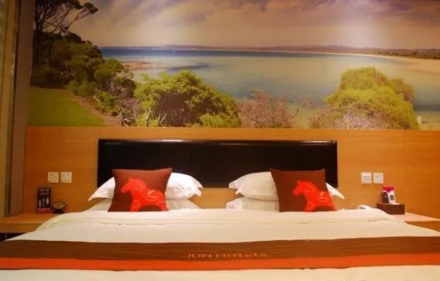 Bed in Junyi Hotel Jinhua Wuyi Hot Spring Bus Terminal Station