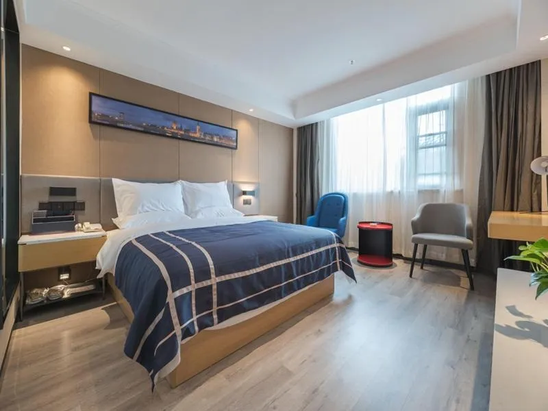 Bed in LanOu Hotel Wuxi Anzhen East High-Speed Railway Station