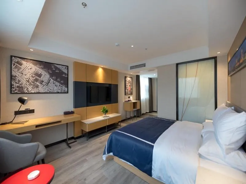 Bed in LanOu Hotel Wuxi Anzhen East High-Speed Railway Station