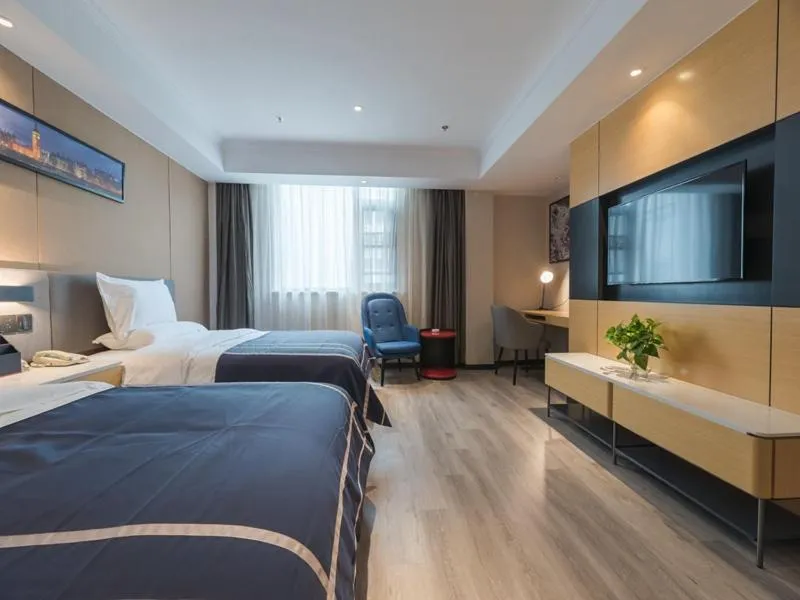 Bed in LanOu Hotel Wuxi Anzhen East High-Speed Railway Station
