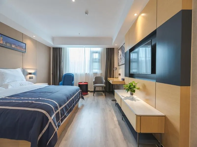 Bed in LanOu Hotel Wuxi Anzhen East High-Speed Railway Station