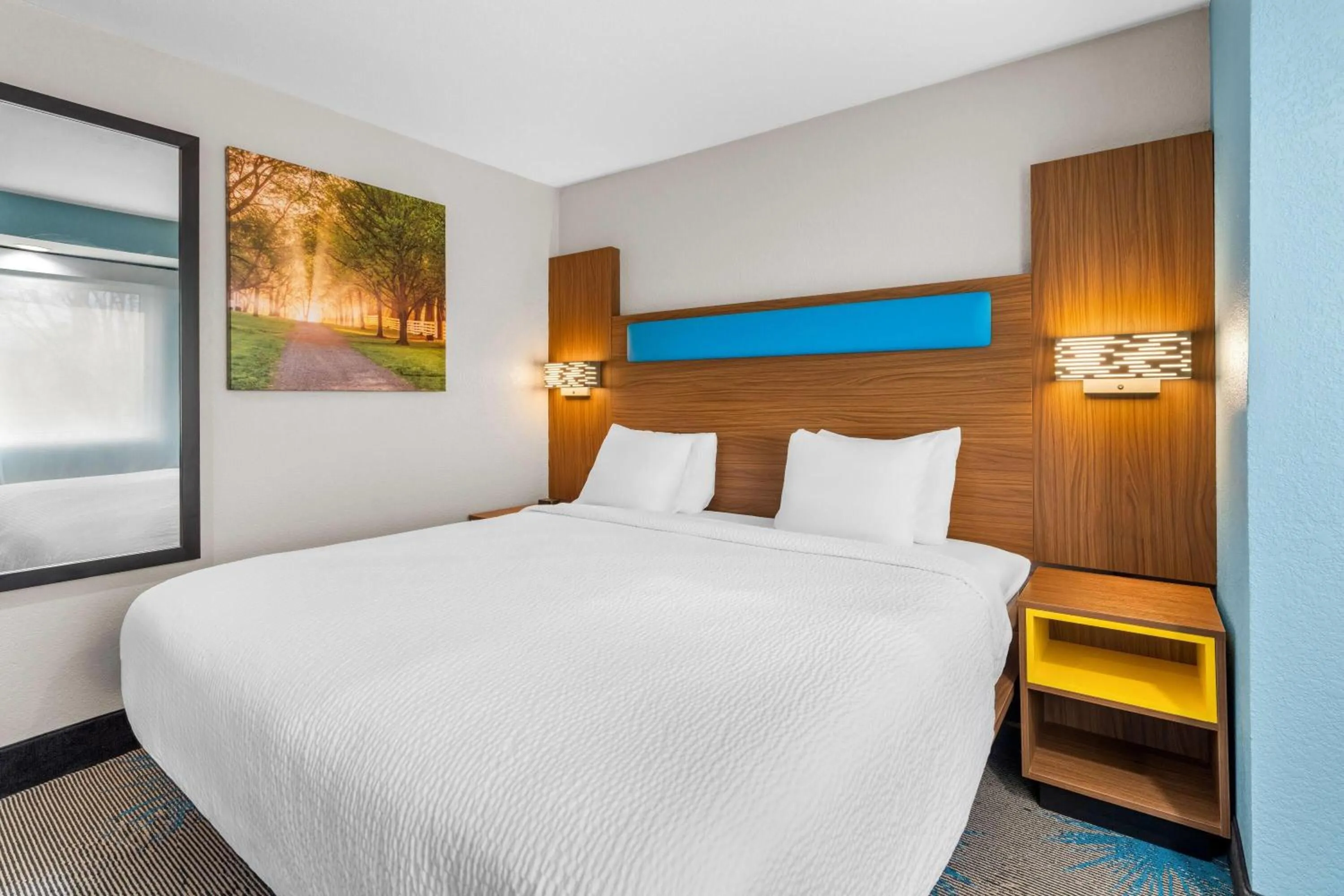 Bed in Days Inn & Suites by Wyndham Brandon Amphitheater