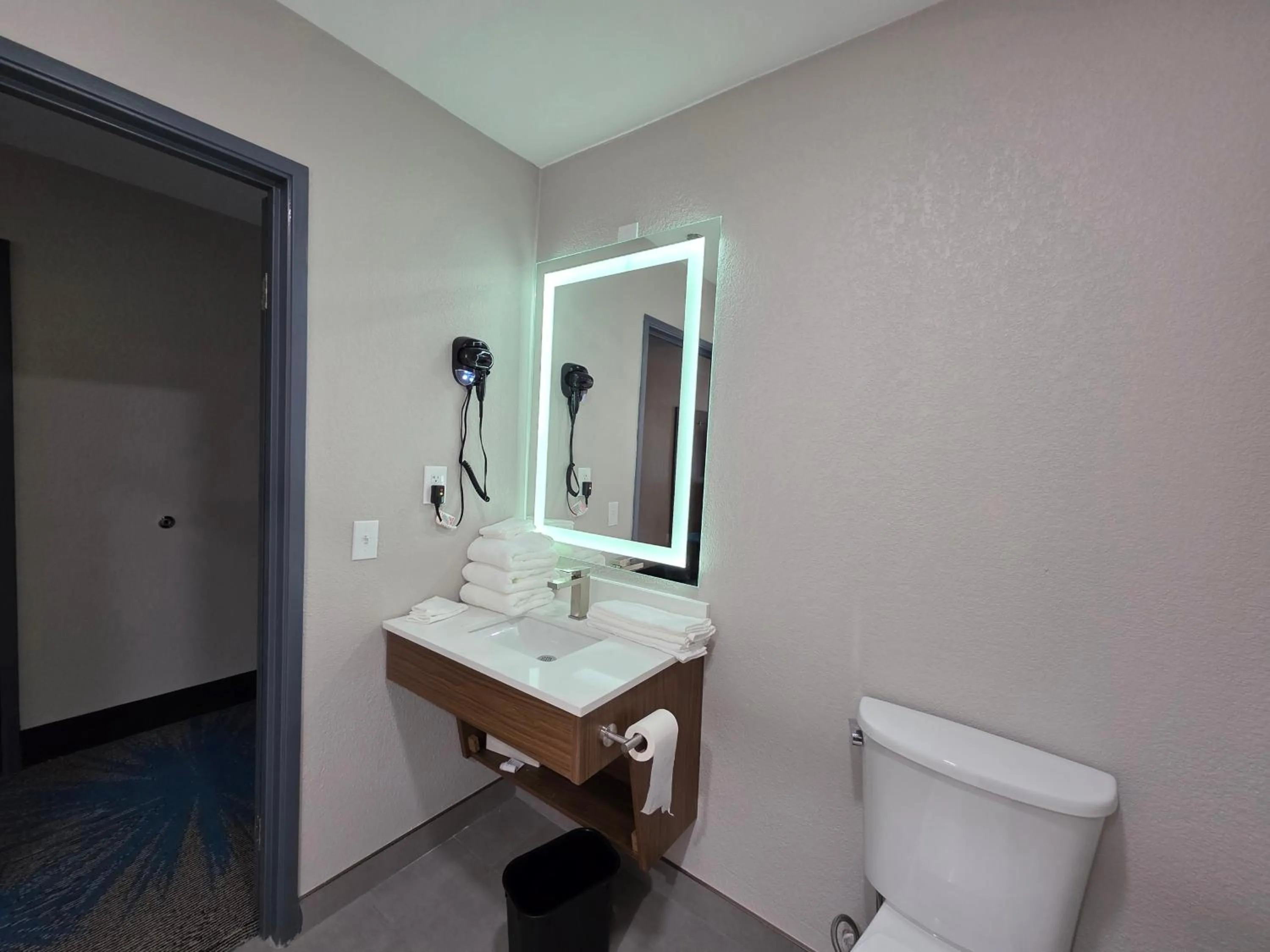 Bathroom in Days Inn & Suites by Wyndham Brandon Amphitheater