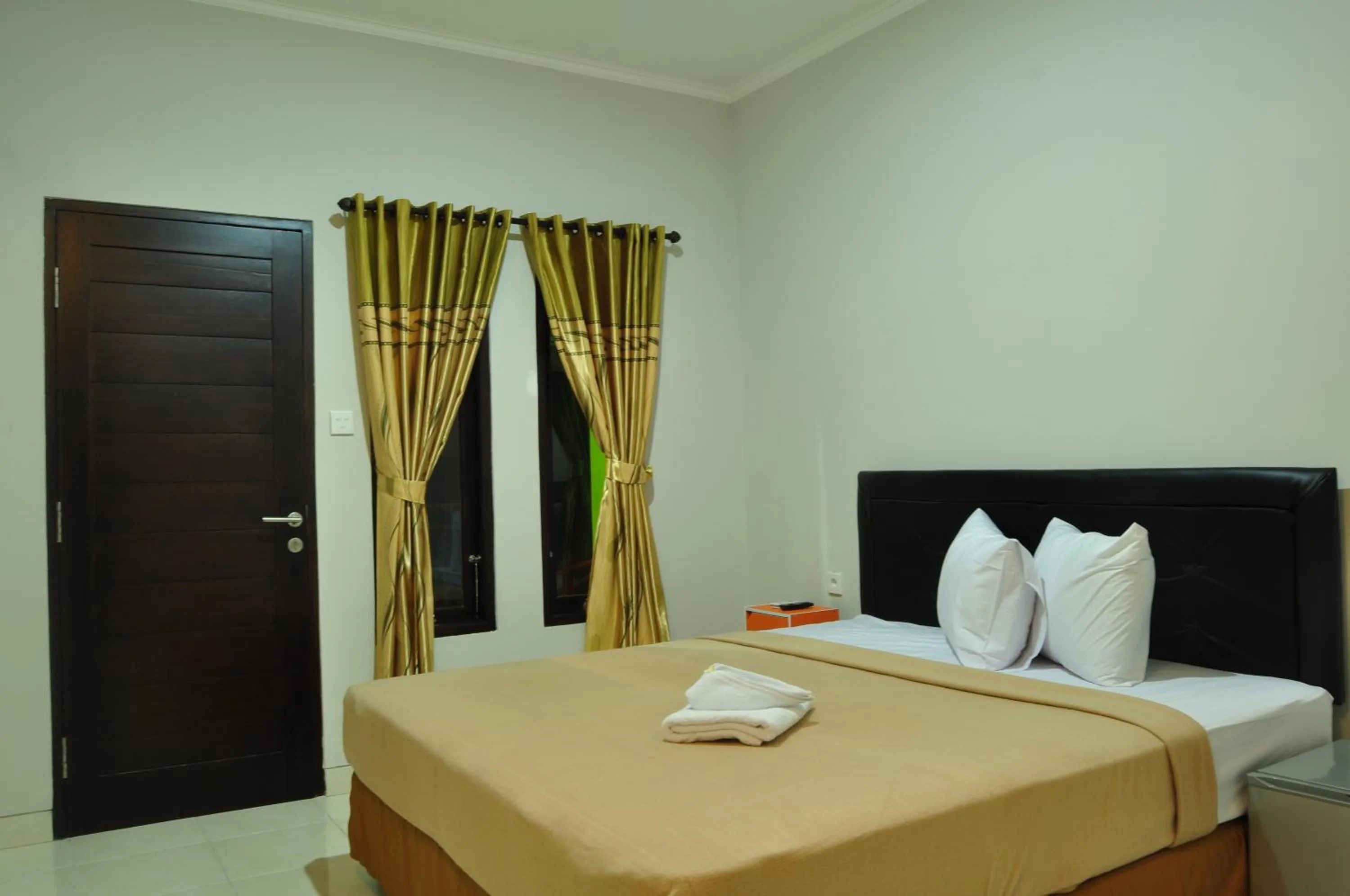Bed in Amerta Home Stay Bali