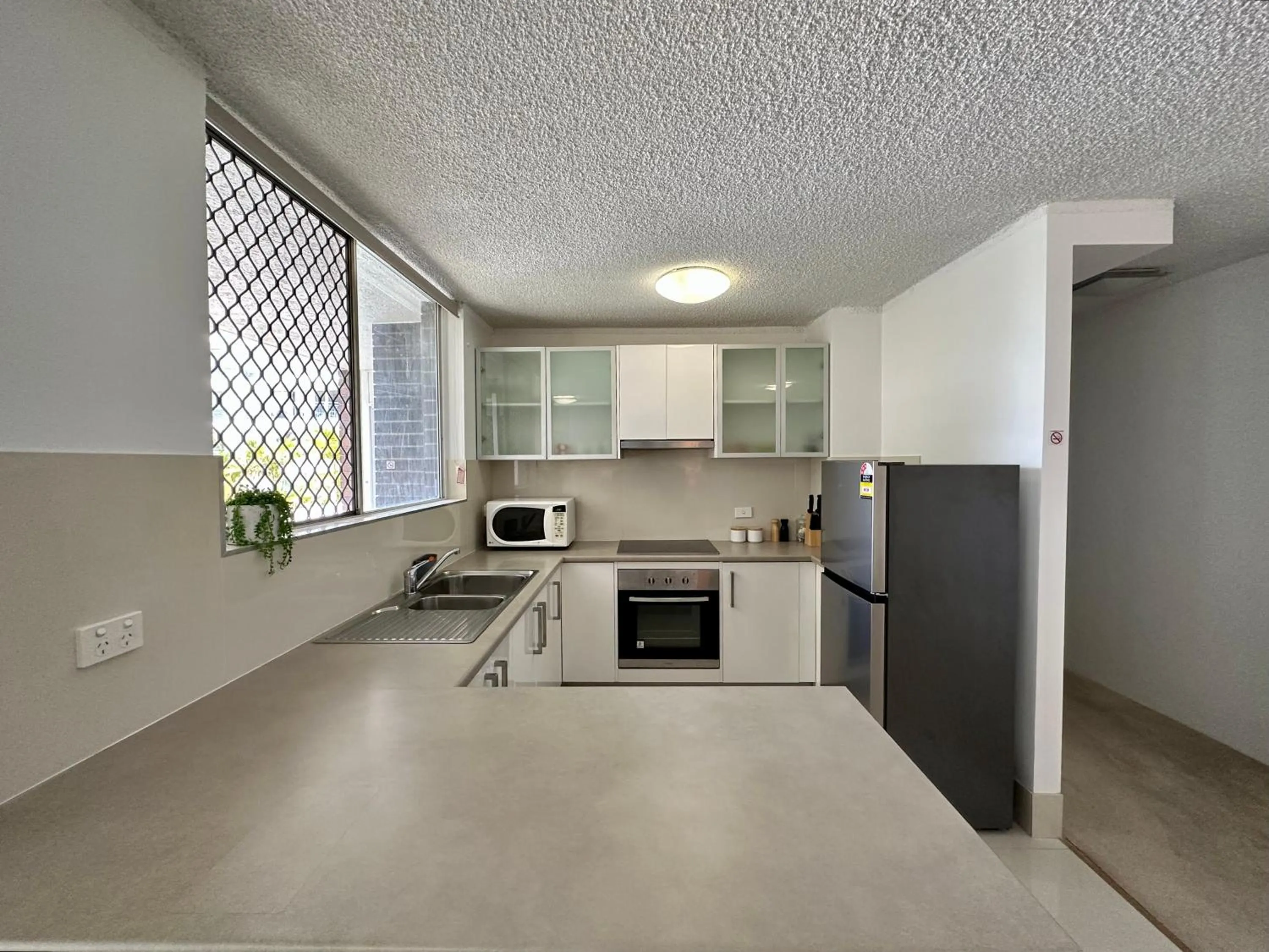 Kitchen or kitchenette in Meridian Tower Kirra Beach