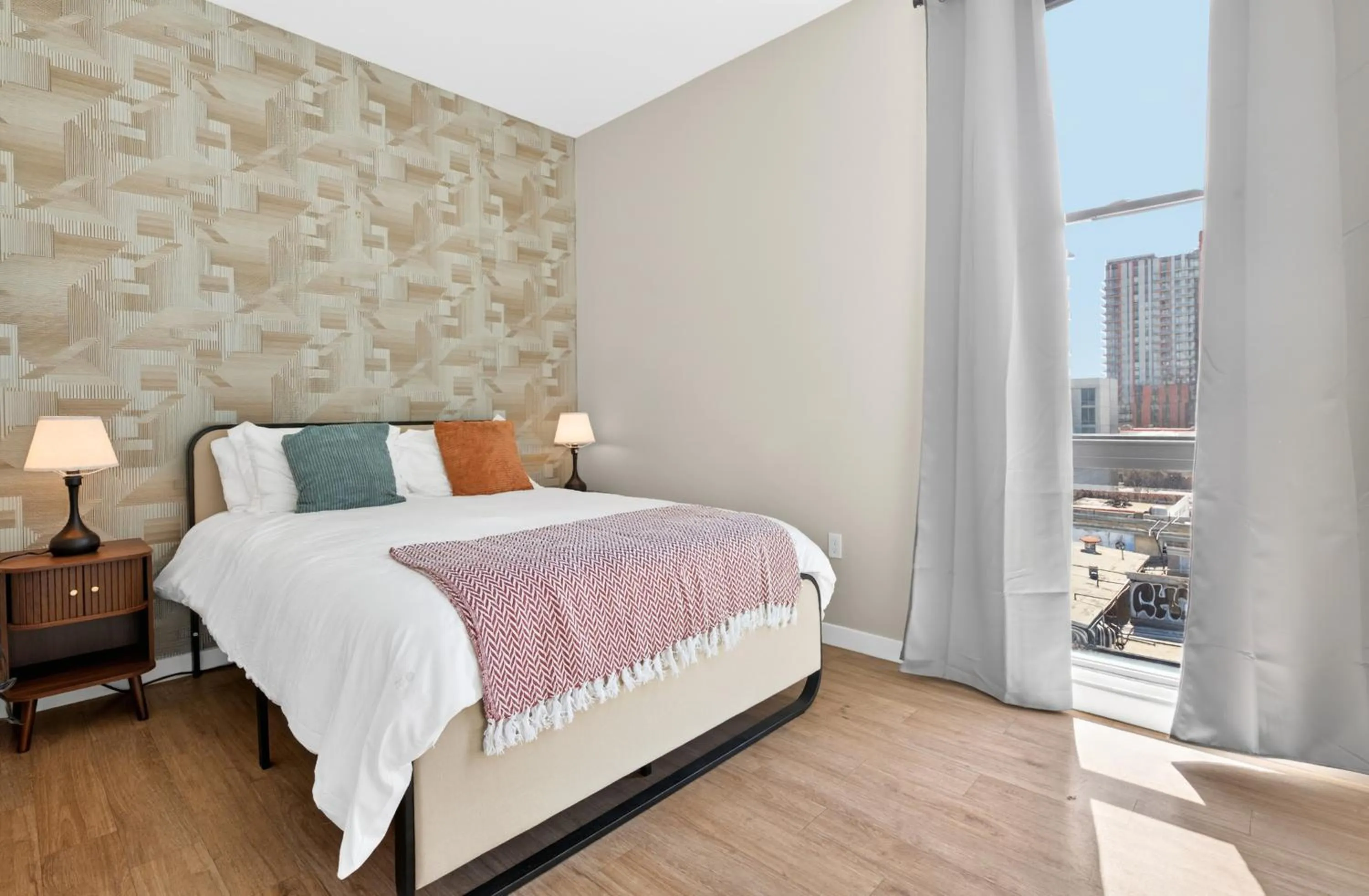 Bed in Modern Downtown Retreat Balcony Rooftop Views