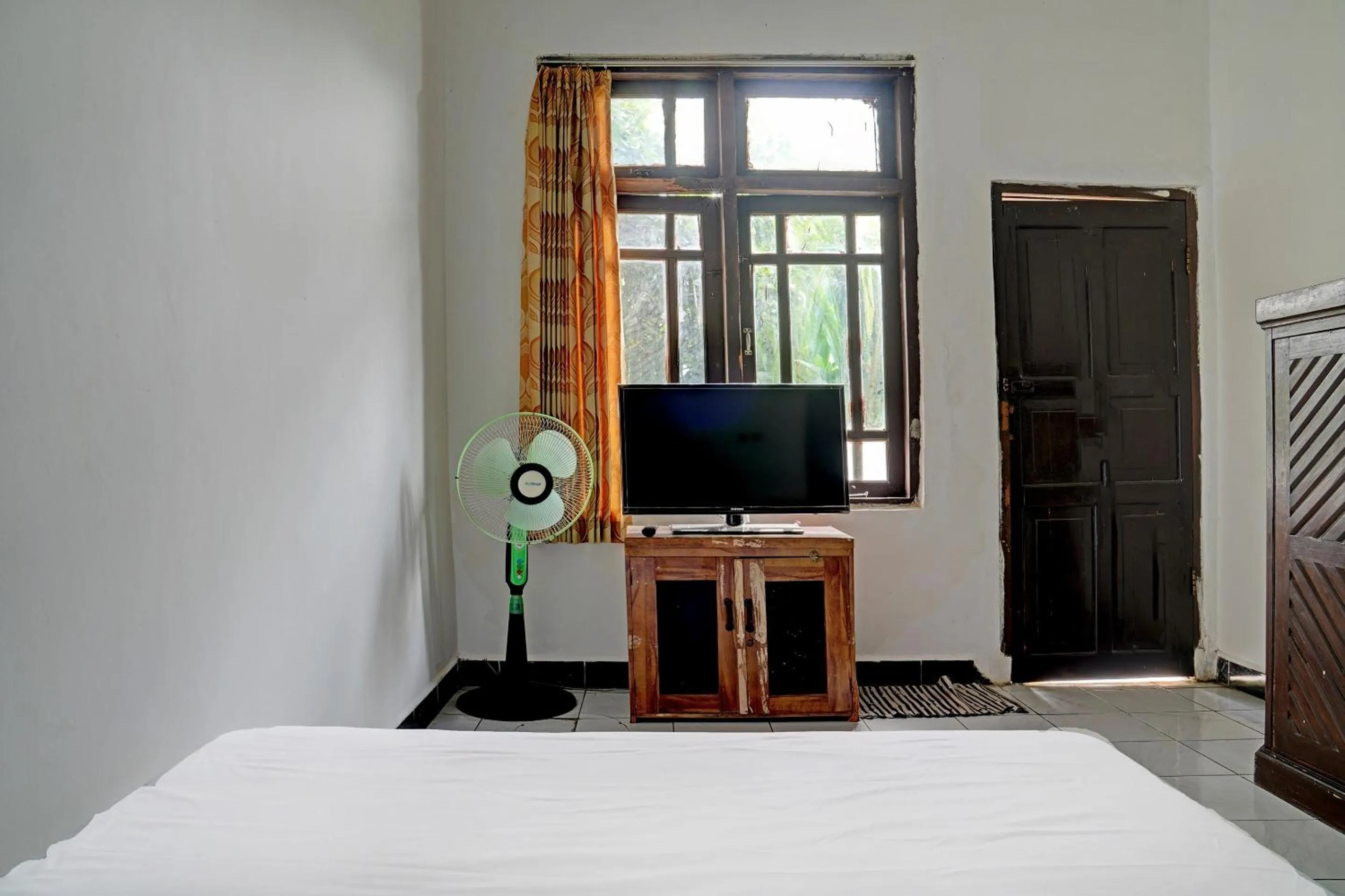 Bedroom in Hotel O Home Stay Syariah Aom Kusman