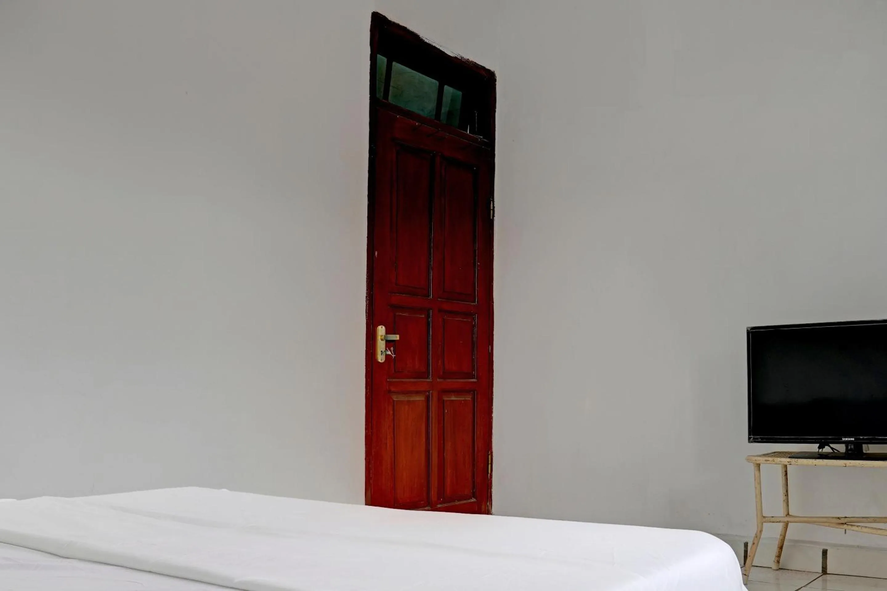 Bedroom in Hotel O Home Stay Syariah Aom Kusman