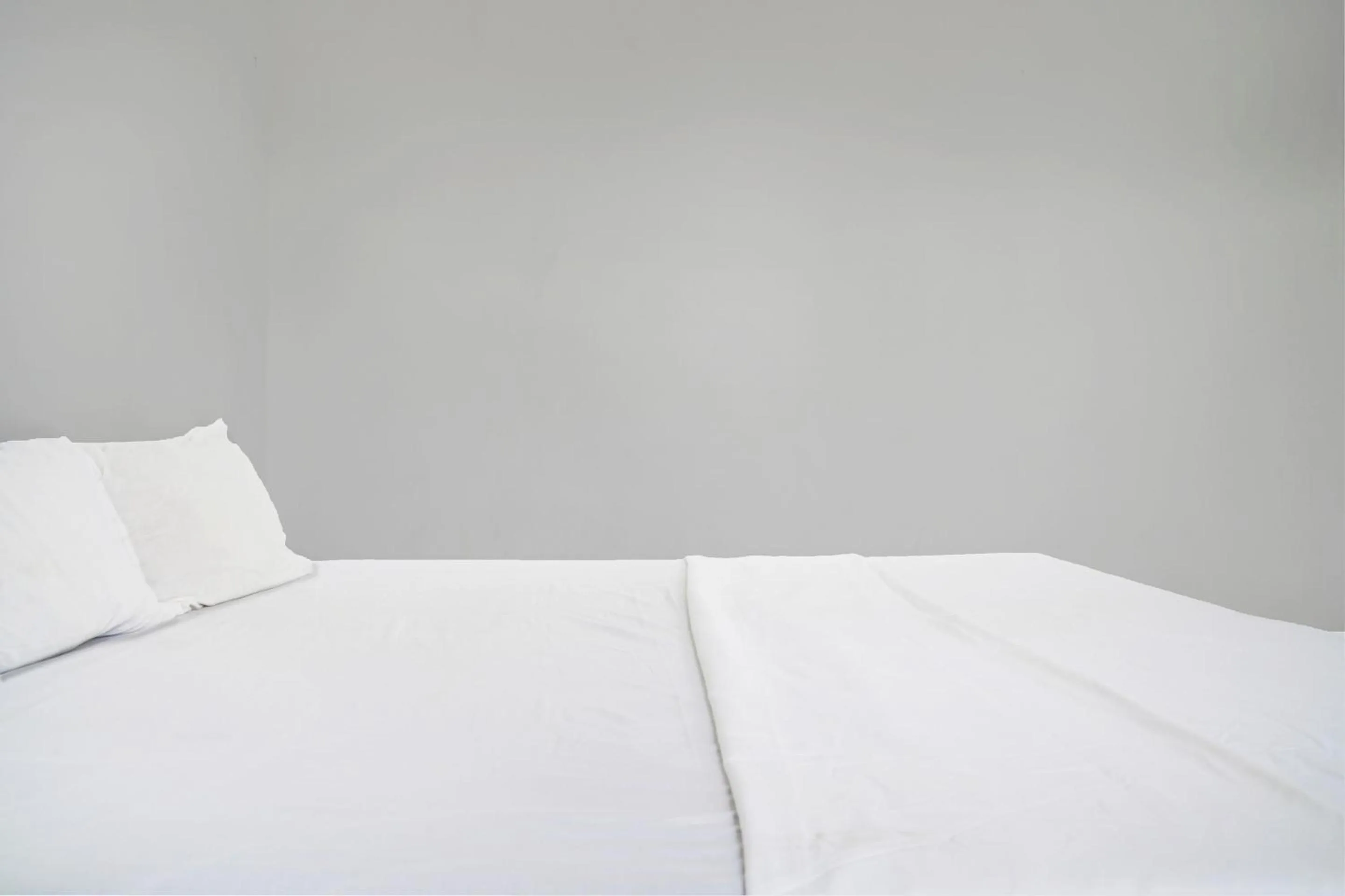 Bedroom in Hotel O Home Stay Syariah Aom Kusman