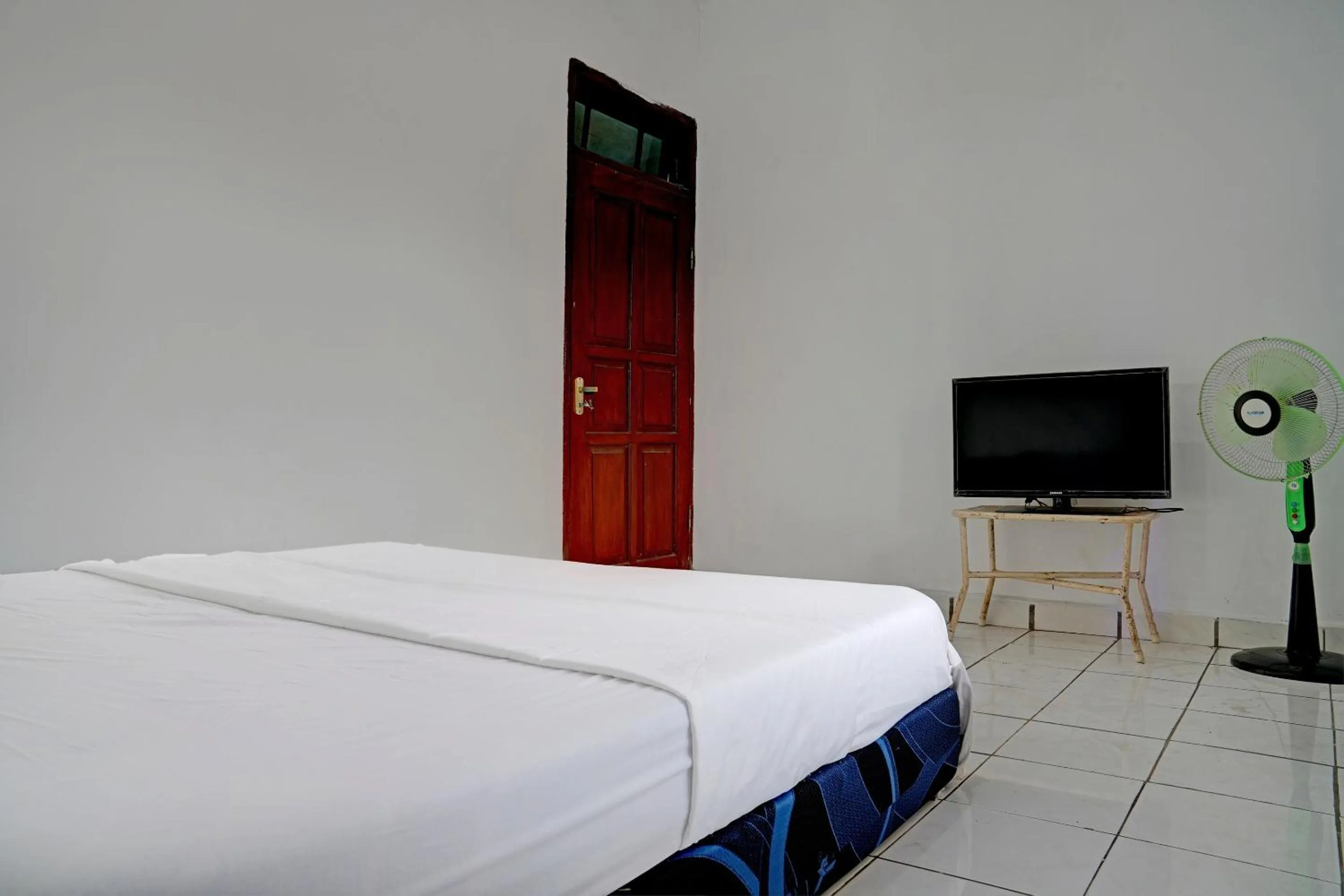 Bedroom in Hotel O Home Stay Syariah Aom Kusman